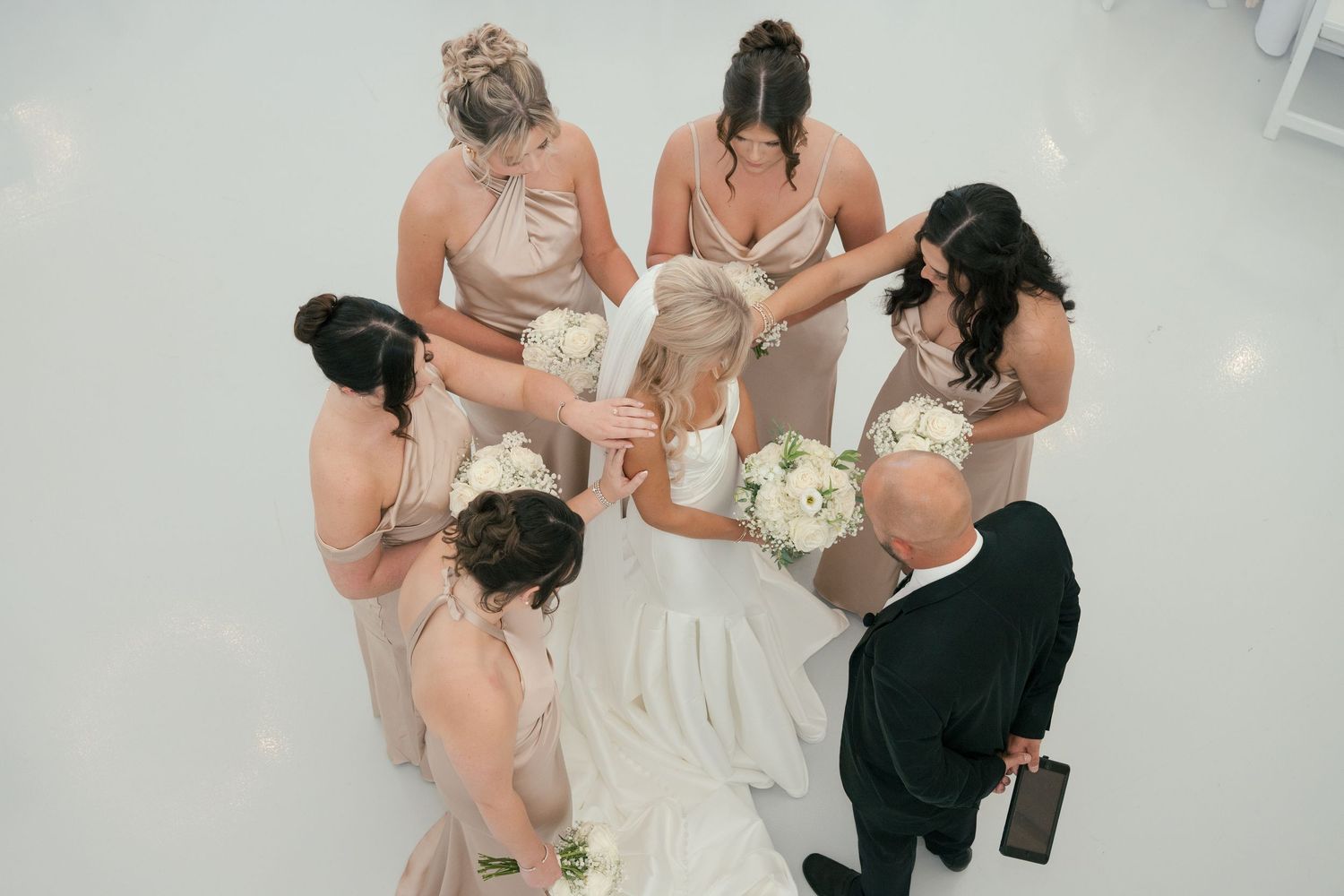 praying over the bride in The Monroe, a Nashville wedding venue