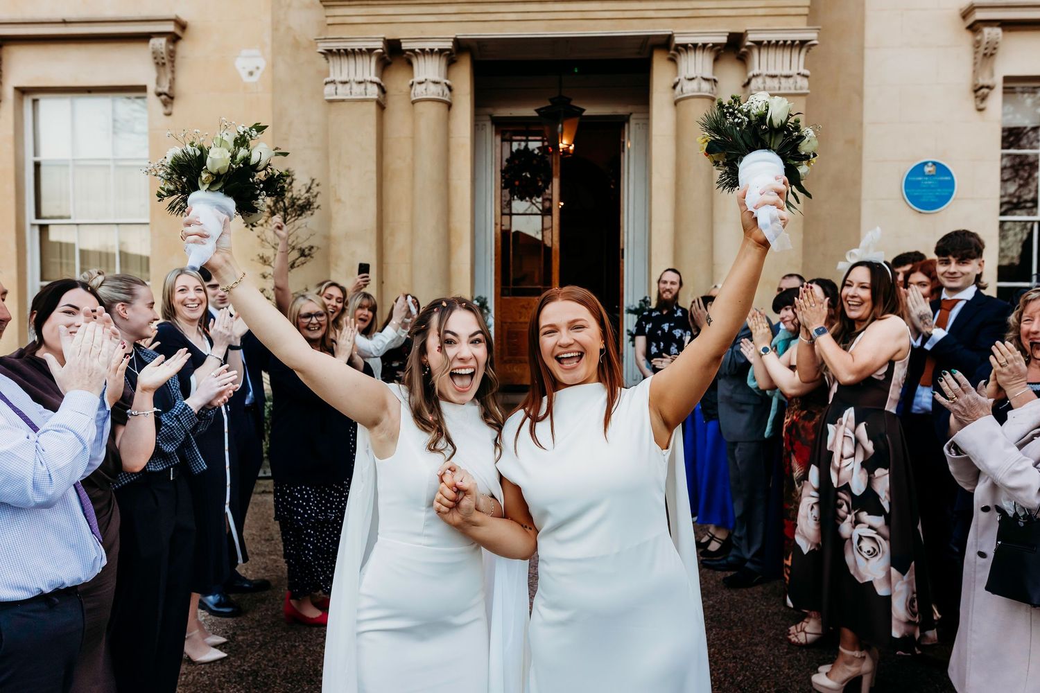 Wedding celebration with guests throwing confetti outside historic wedding venue Elizabeth Gaskell's House, Manchester.  Intimate Wedding.