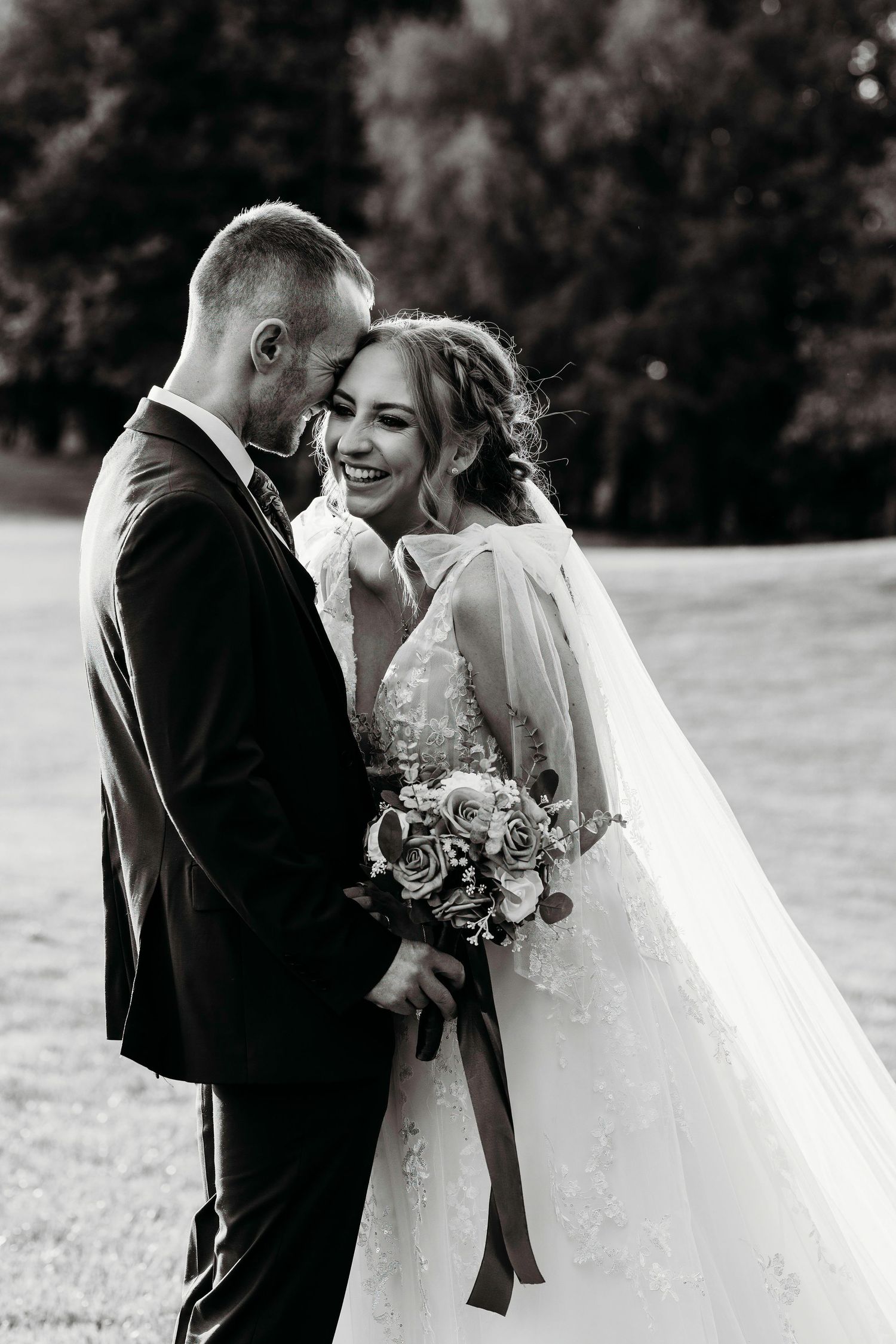 Black and white romantic wedding portraits showing tender moments between newlyweds at Worsley Marriot Hotel, Worsley.