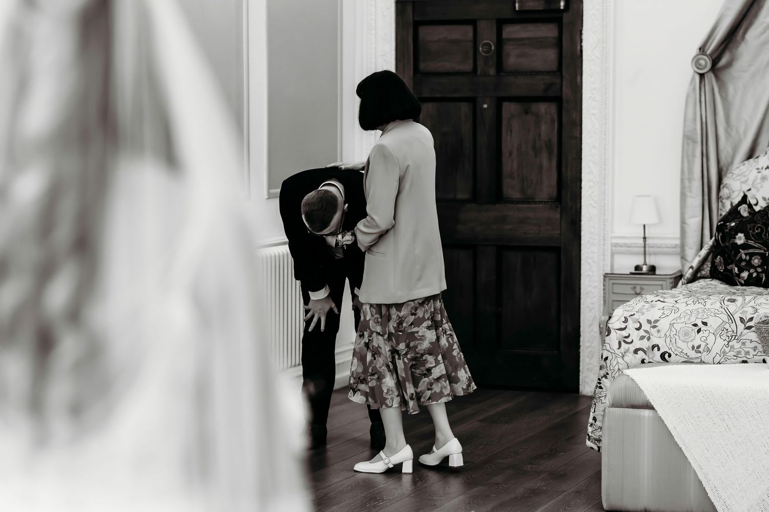 Black and white first look wedding photos showing emotional family member on seeing bride at the Olde Palace Chester.