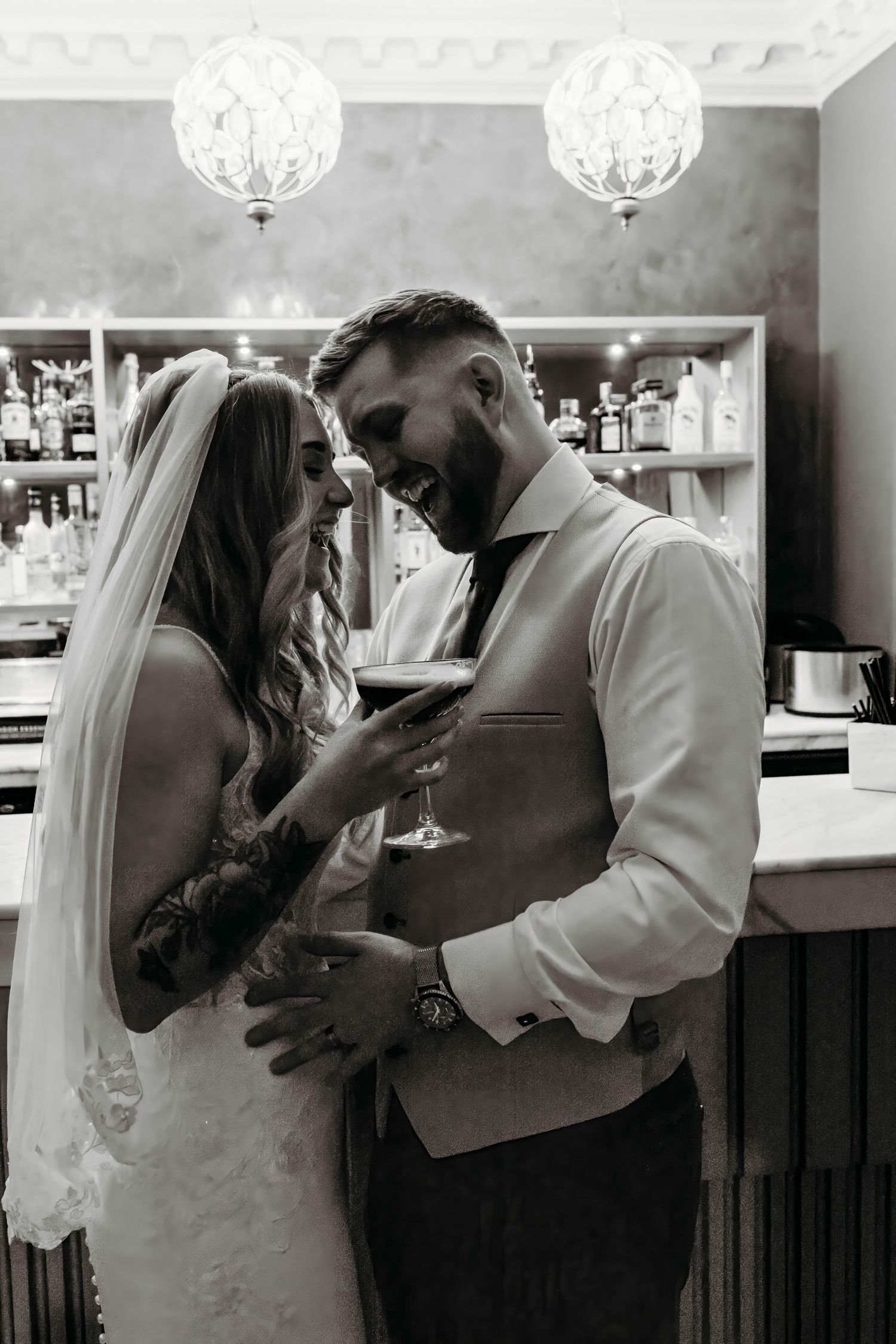 Black and white wedding photos showing tender moments between newlyweds at the Old Palace Chester.
