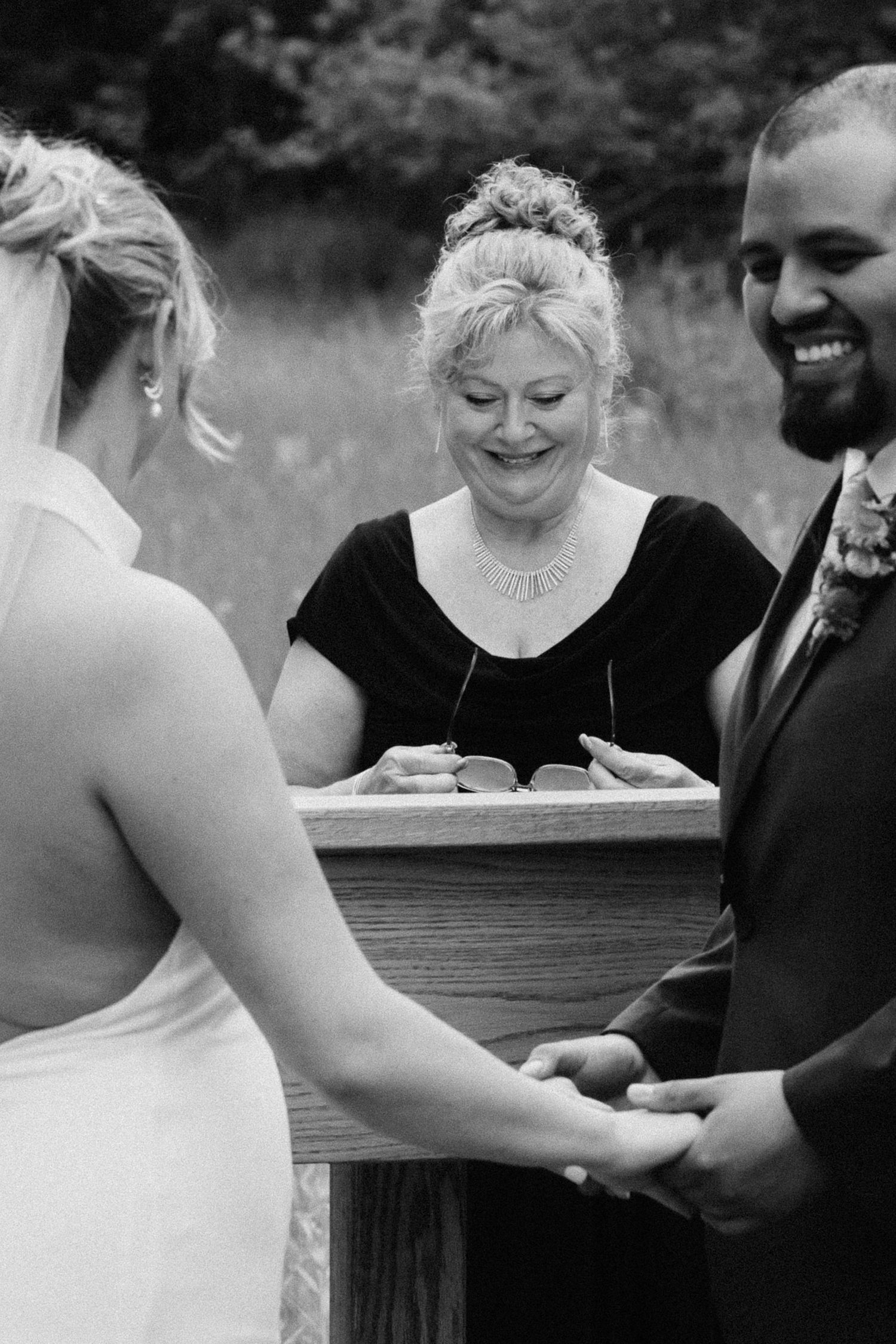 Black and white photo series of a couple sharing intimate moments during their wedding ceremony.