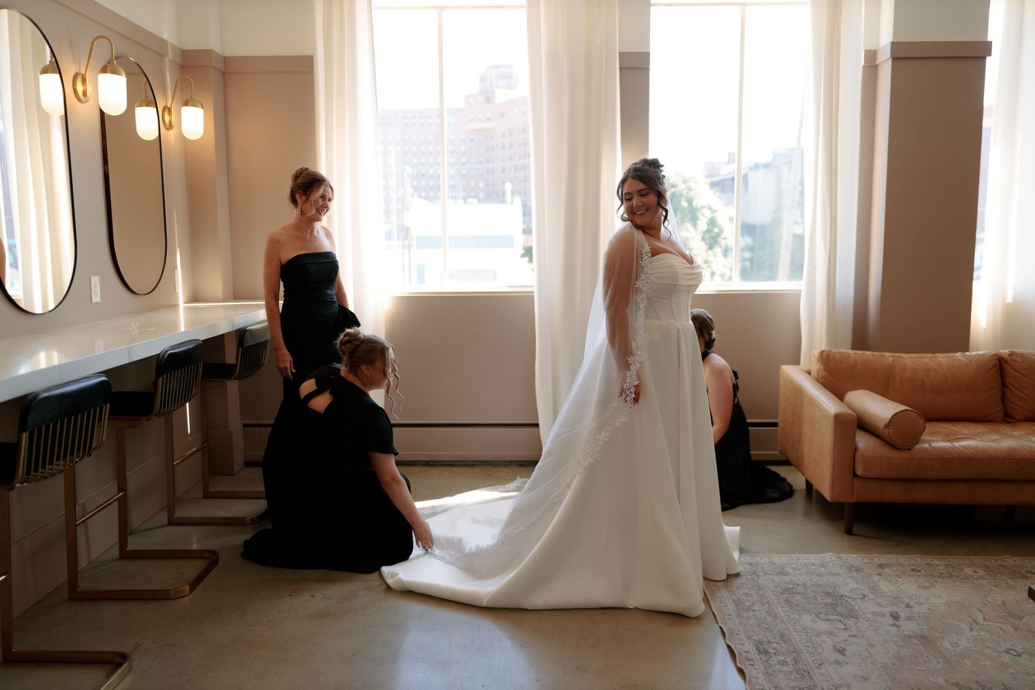 Elegant bridal suite interior with large windows and natural light streaming in.