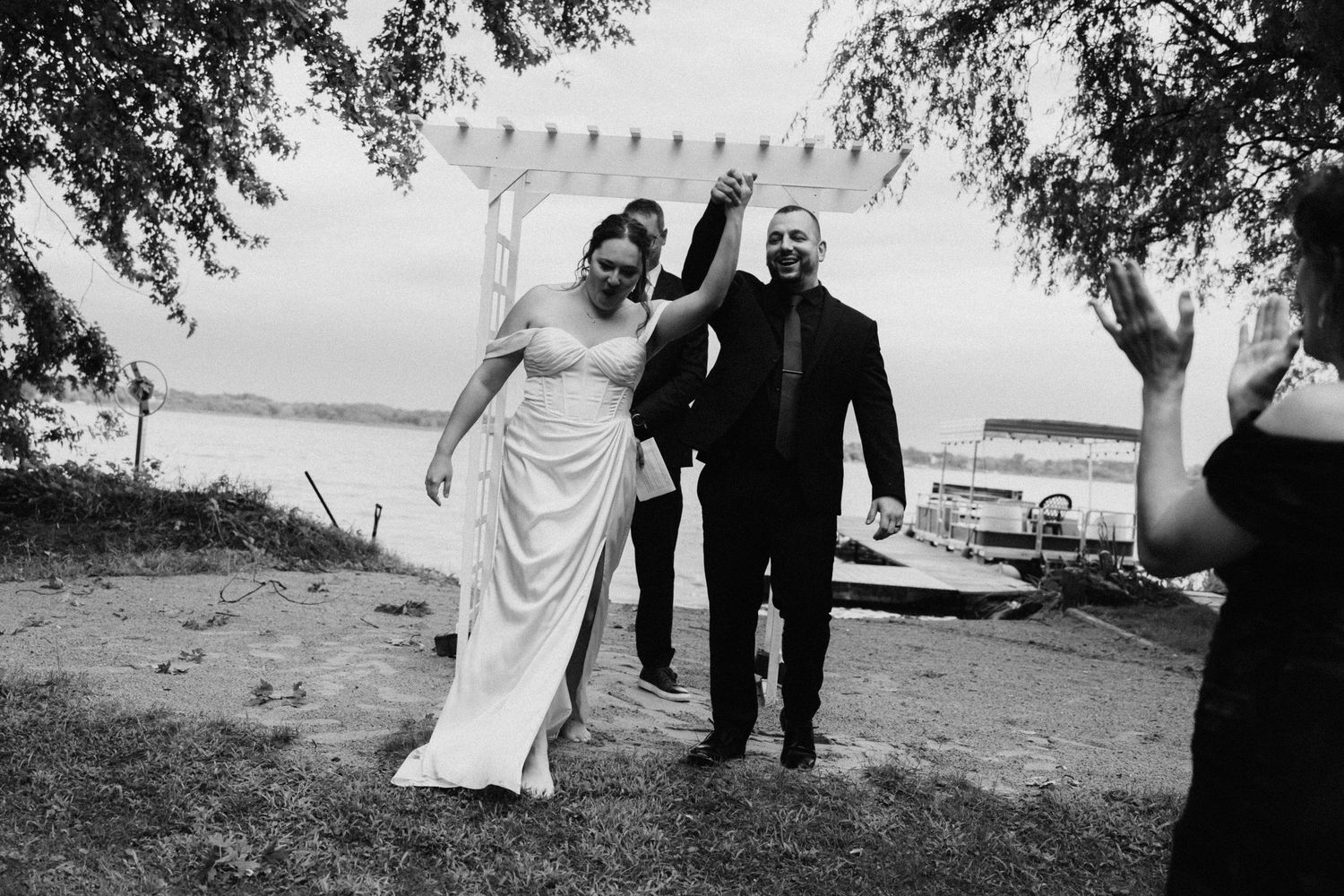 Black and white panoramic series of wedding party walking outdoors.