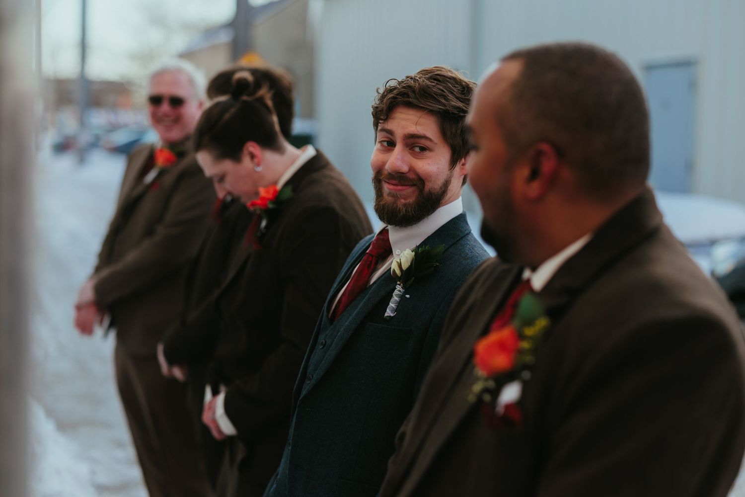 Wedding guests watch and smile during an emotional celebration moment.