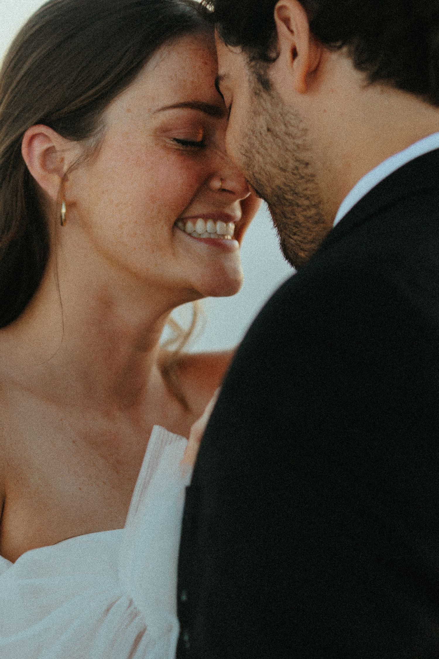 Romantic close-up moment captured in soft lighting and intimate poses.