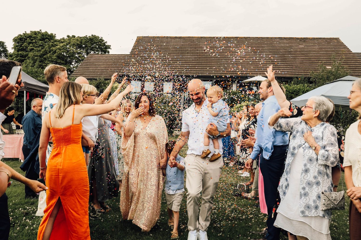 bride and groom at reception in West Sussex, Petworth. relaxed wedding, documentary photography. Dancing, evening reception, fun