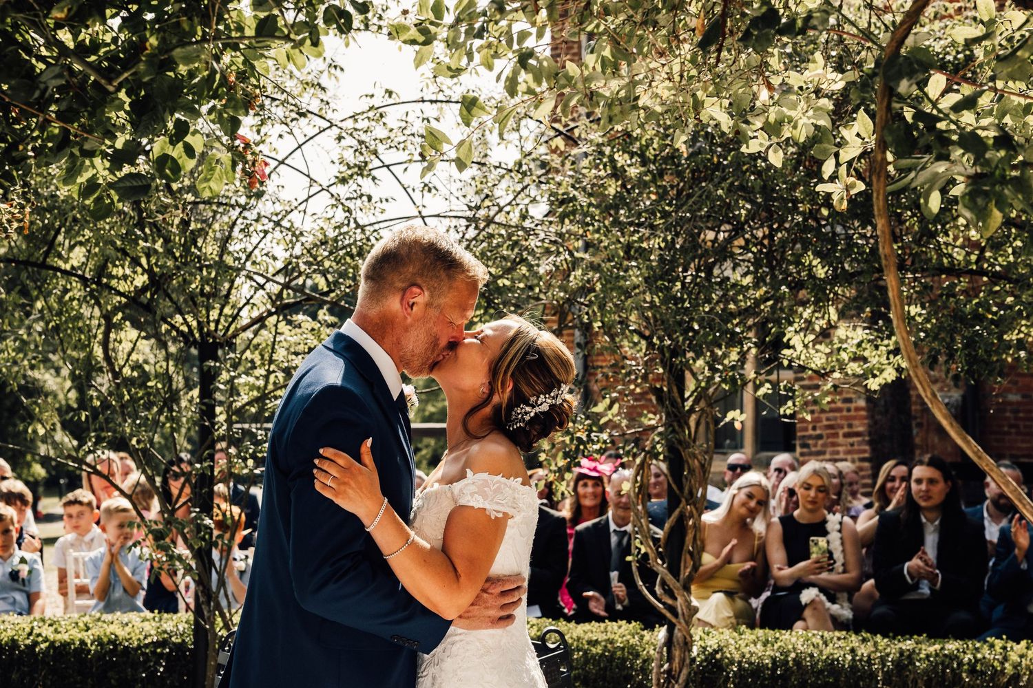Pendall court, bletchingly, Surrey. listed wedding venue couple bride and groom confetti shot. wedding. evening reception. guests having fun