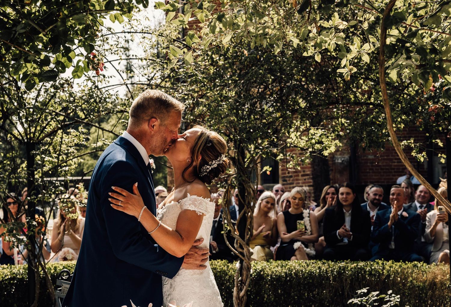 bride and groom at reception in West Sussex, Petworth. relaxed wedding, documentary photography. Dancing, evening reception, fun
