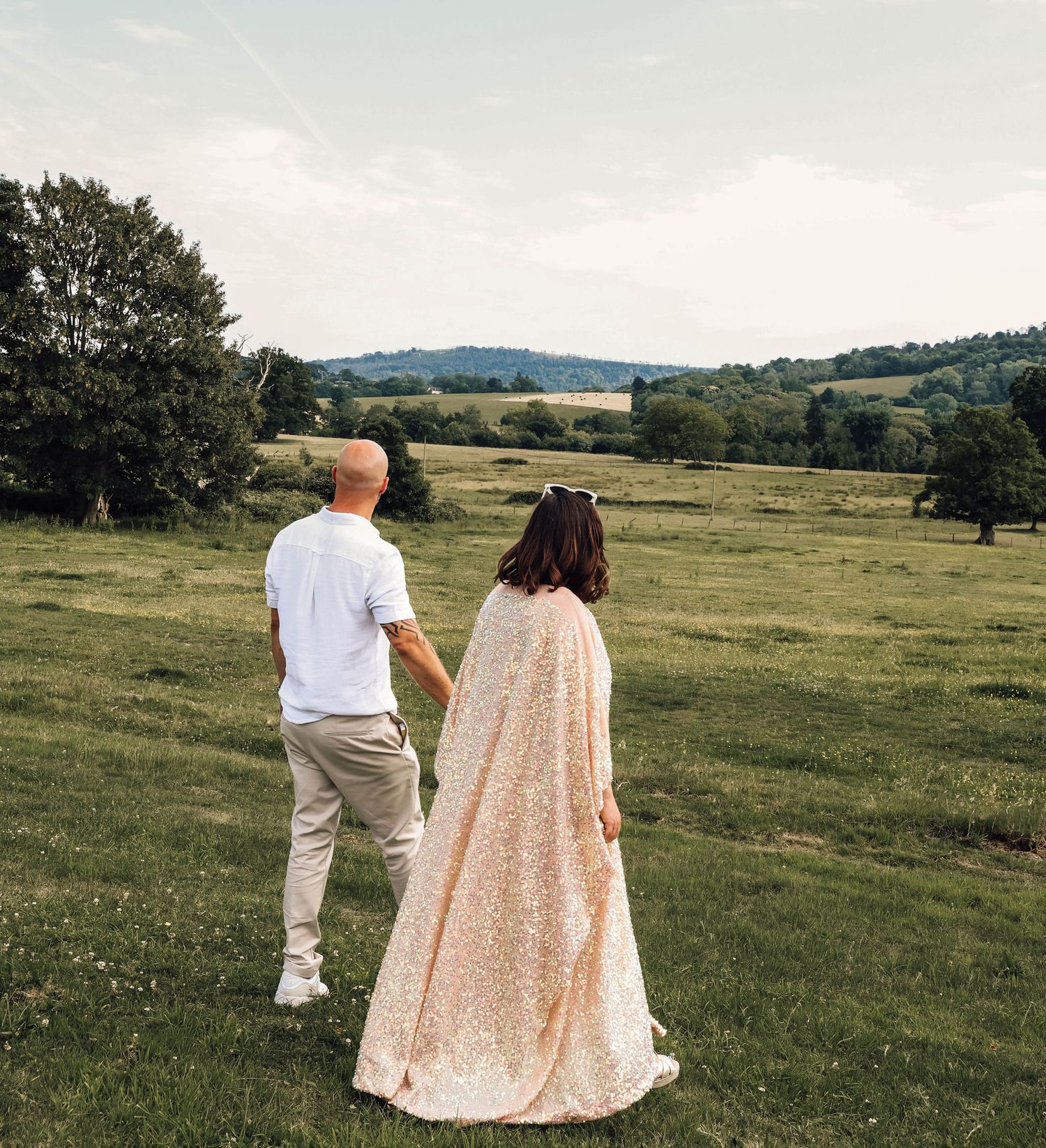 bride and groom at reception in West Sussex, Petworth. relaxed wedding, documentary photography. Dancing, evening reception, fun