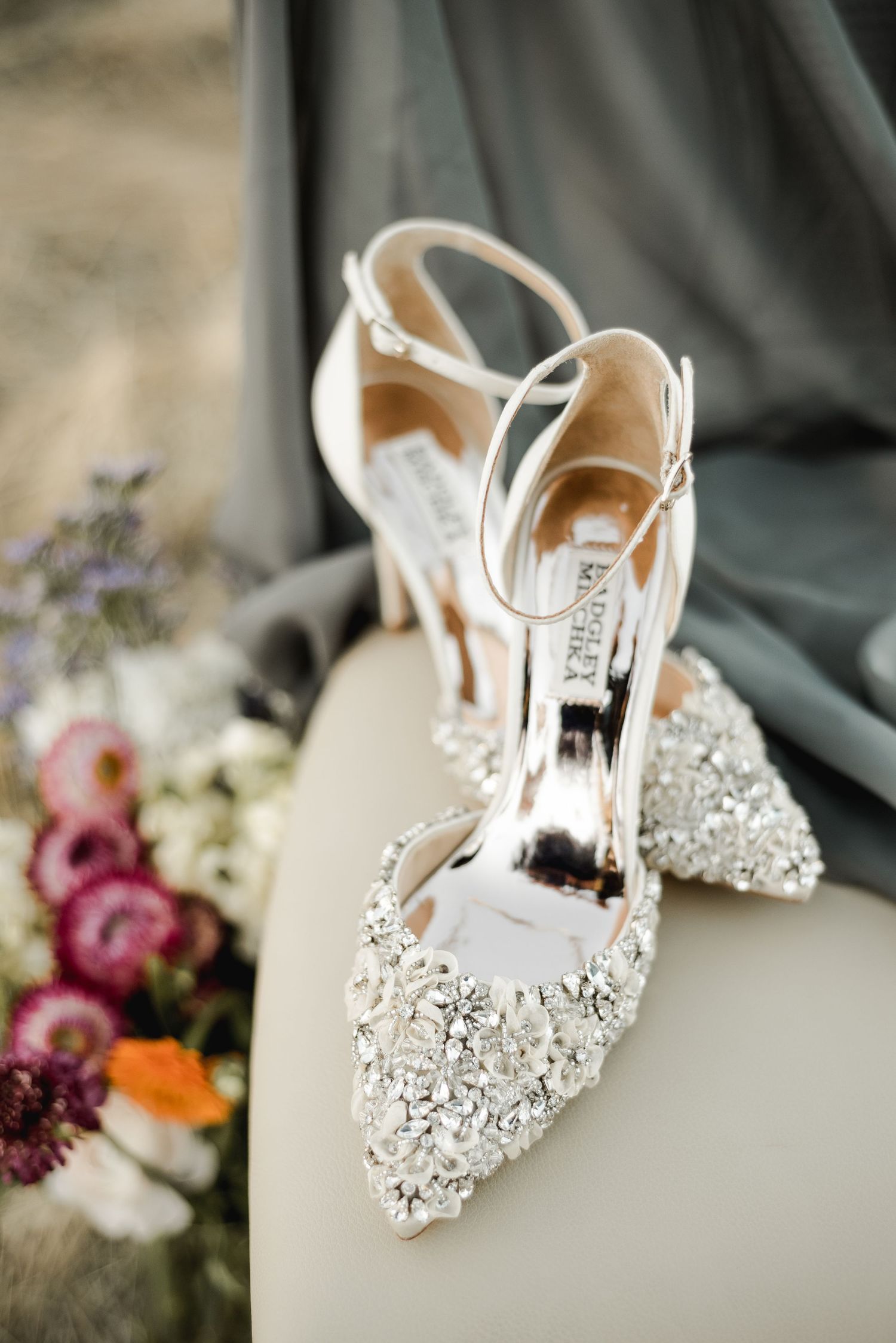 Crystal embellished bridal shoes with floral accents.