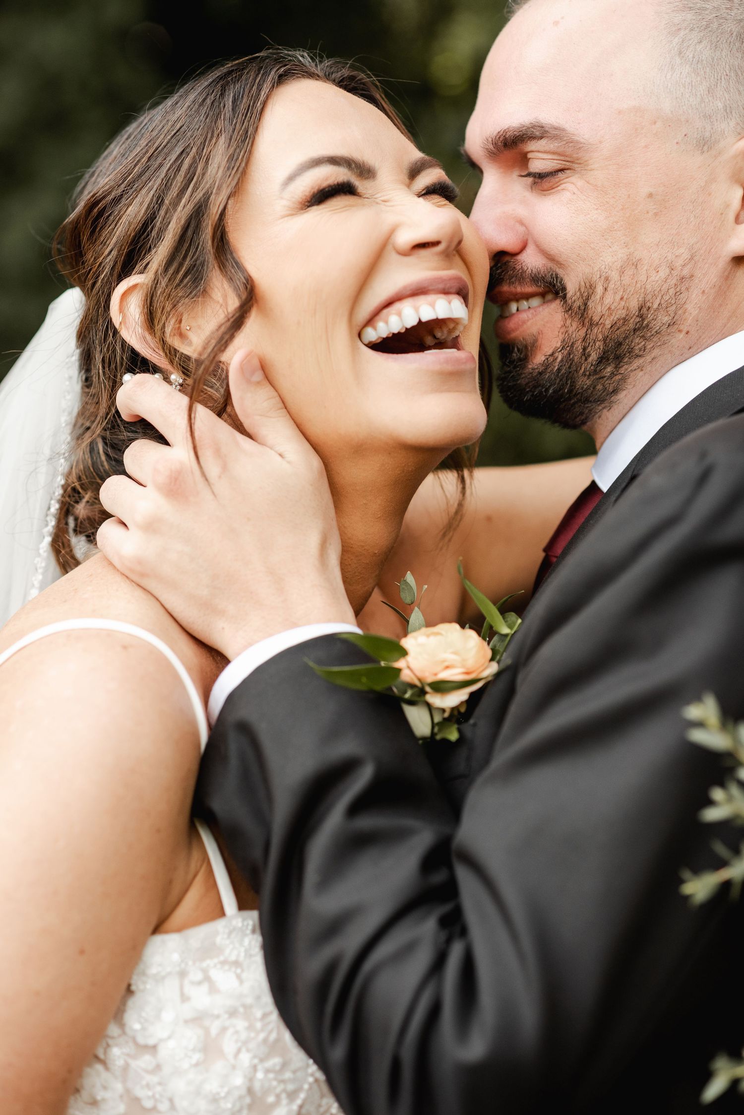 A joyful moment captured between a couple during their wedding celebration.