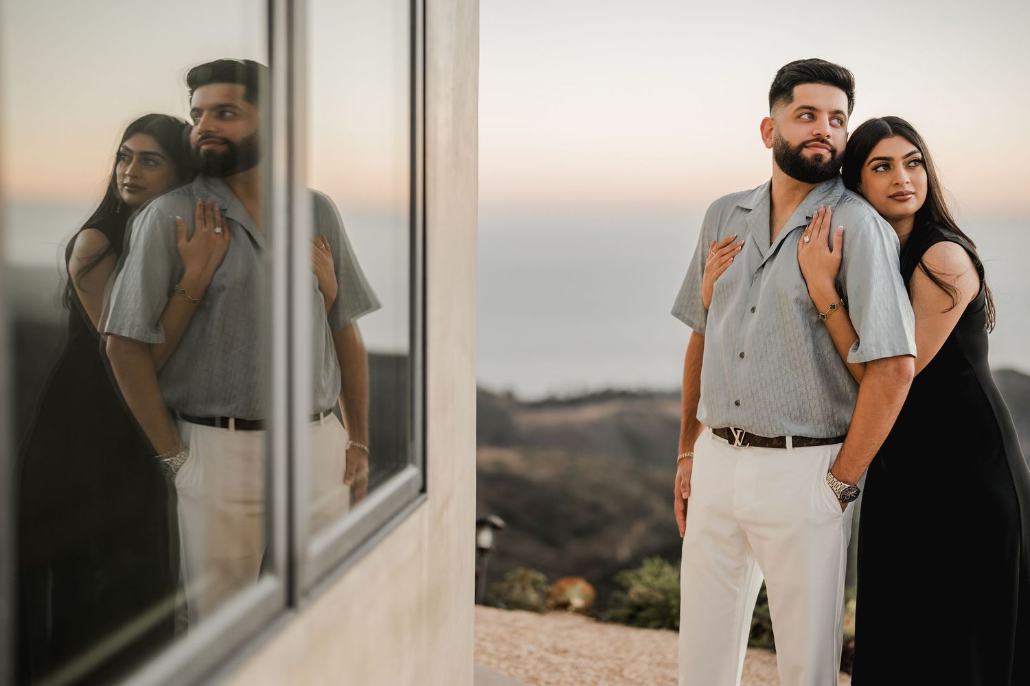 Couple embracing by reflective window with scenic mountain view at sunset.