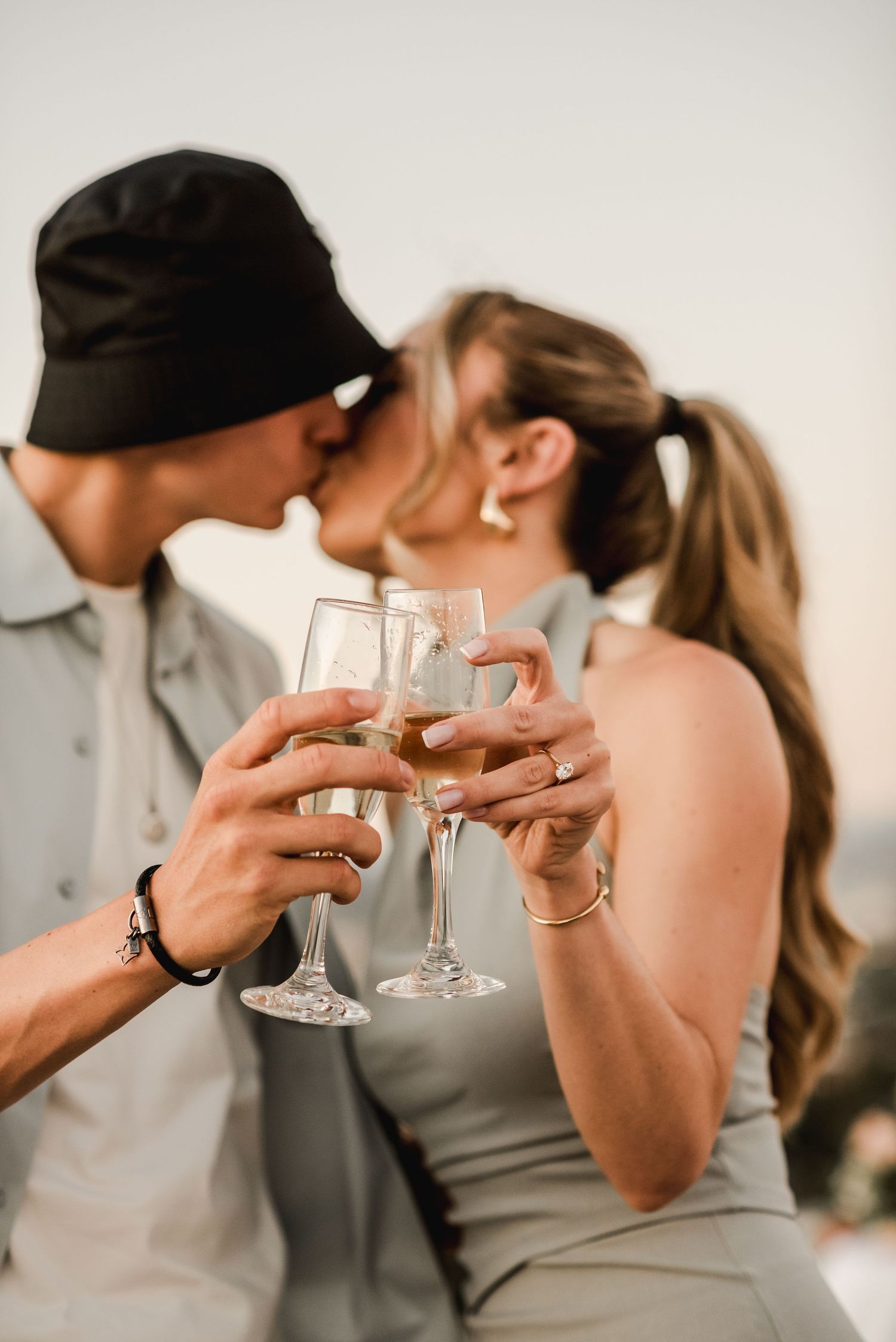 Series of close-up shots showing hands toasting with champagne glasses.