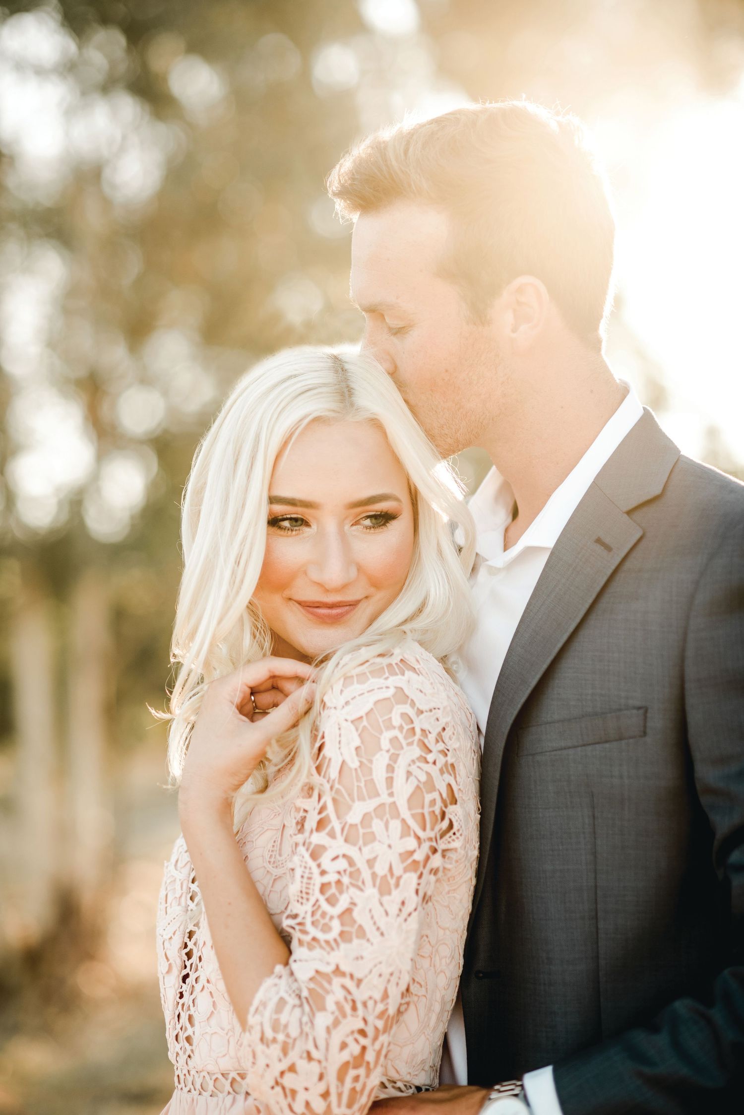 Intimate wedding portraits captured in golden sunset light.