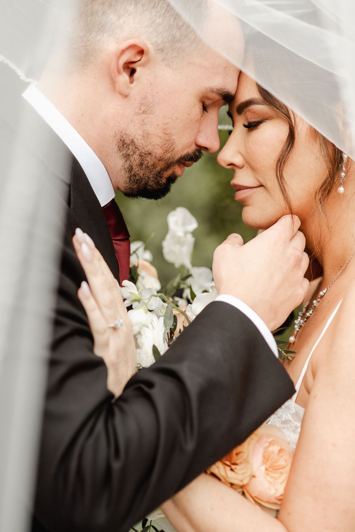 Romantic close-up wedding portrait sequence showing tender moments between newlyweds in traditional attire.