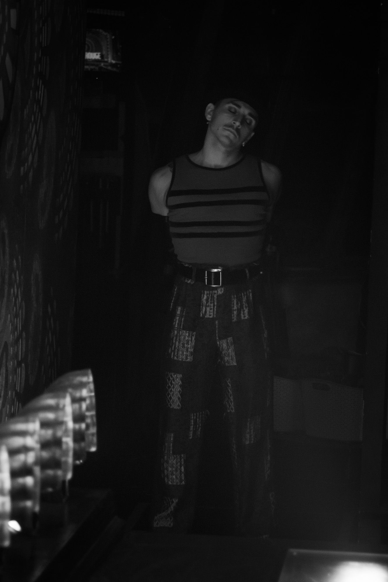 Black and white image of one of a performer at Moulin Rouge! The Musical in London. Backstage image of a performer moments before the show.