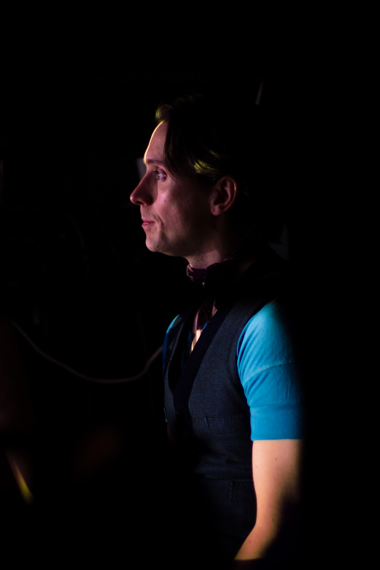 Colour image of one of a performer at Moulin Rouge! The Musical in London. Backstage image of a performer waiting in the wings.
