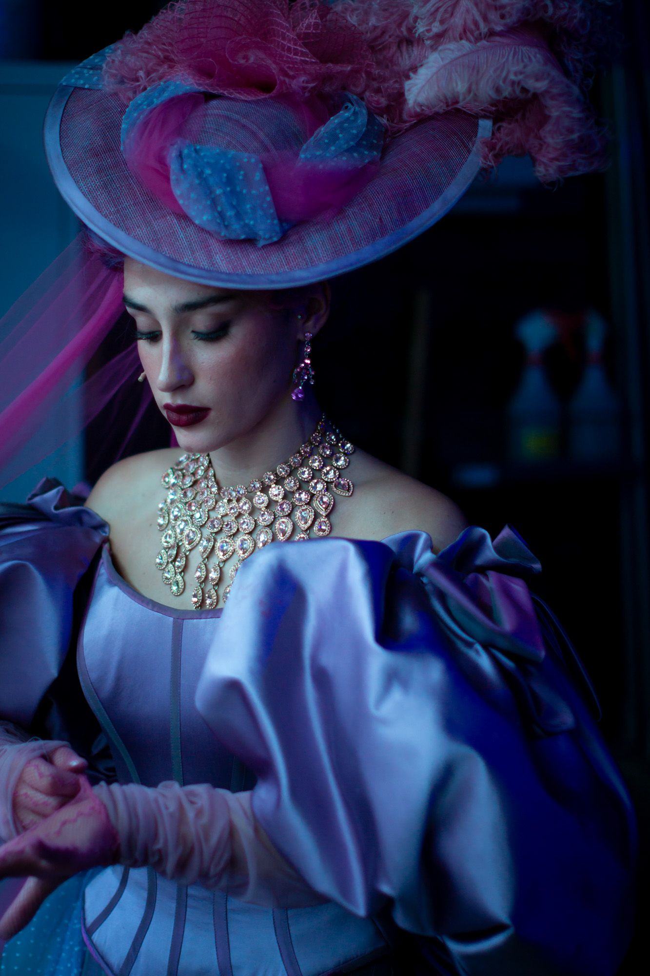 Colour image of one of a performer at Moulin Rouge! The Musical in London. Backstage image of a performer during a quick change.