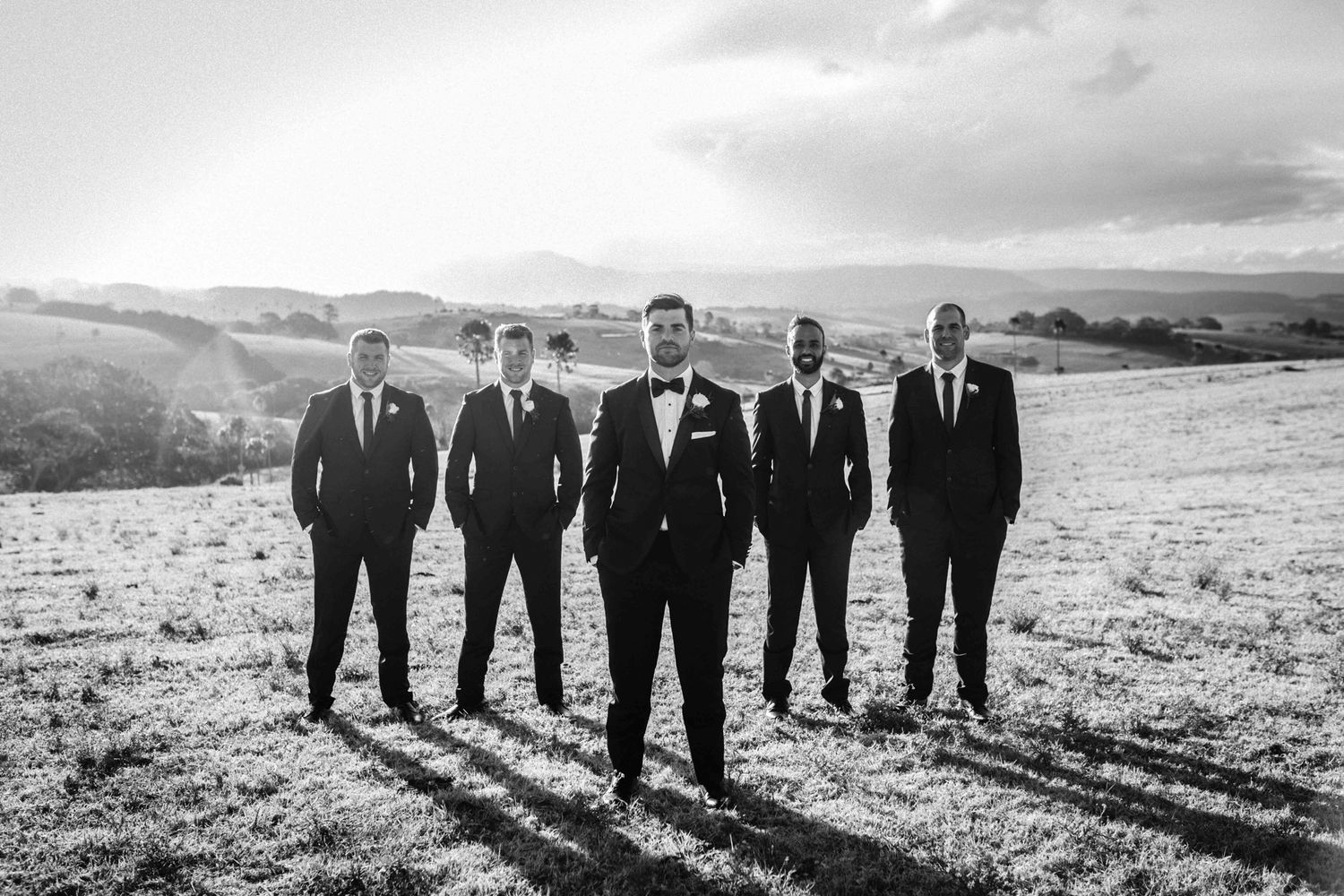 Dramatic pastoral landscape shot near Kiama used for winter wedding portraits of groom and groomsmen.