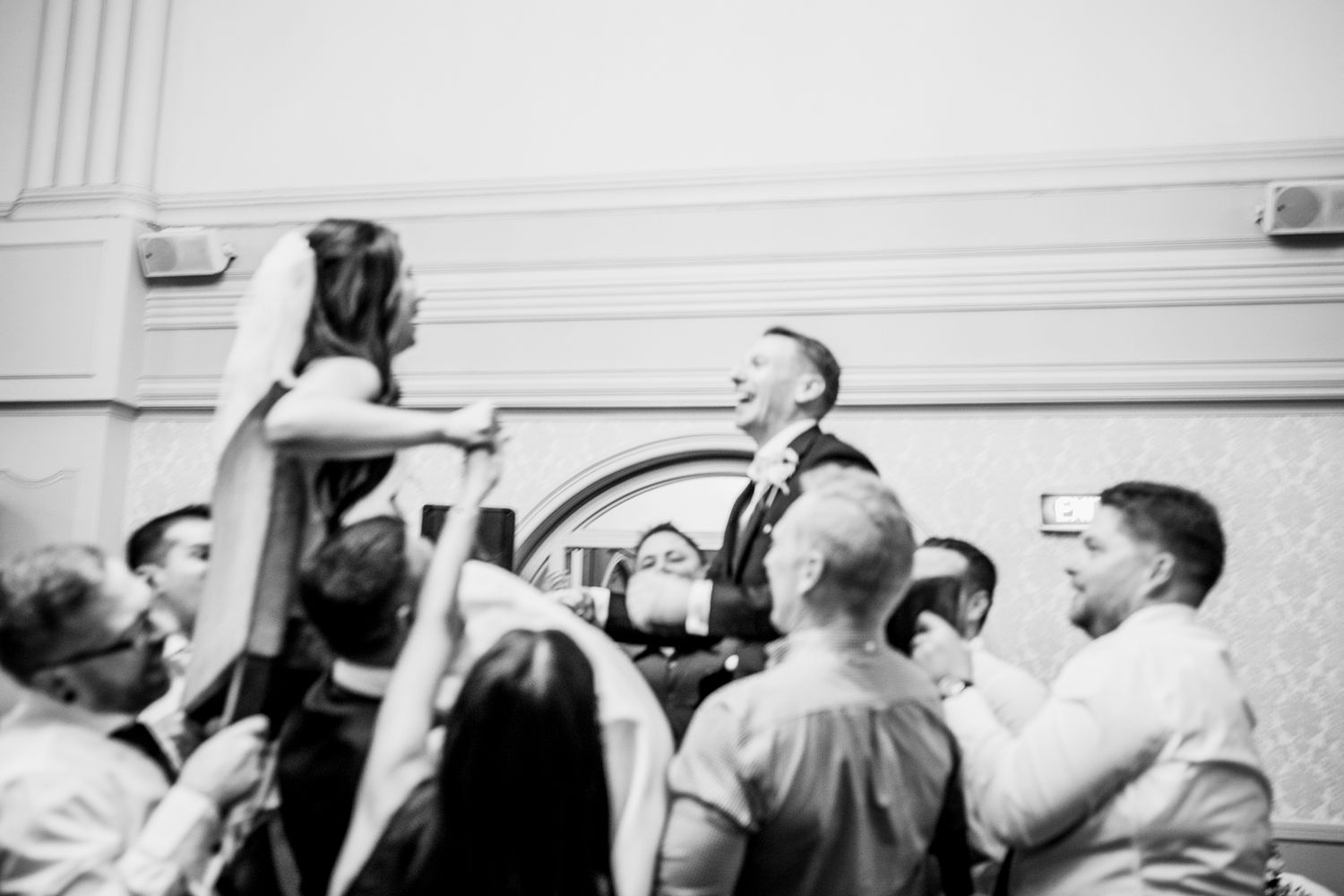 Joyful dancing during the reception at The Tea Room QVB captured by Koco Weddings.