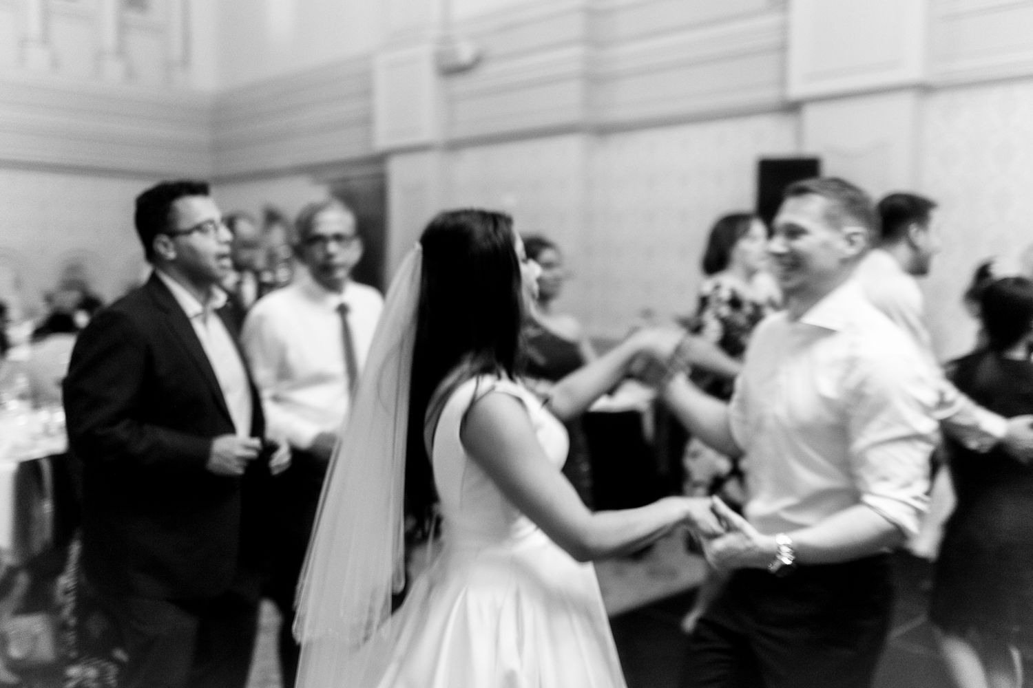 Joyful dancing during the reception at The Tea Room QVB captured by Koco Weddings.