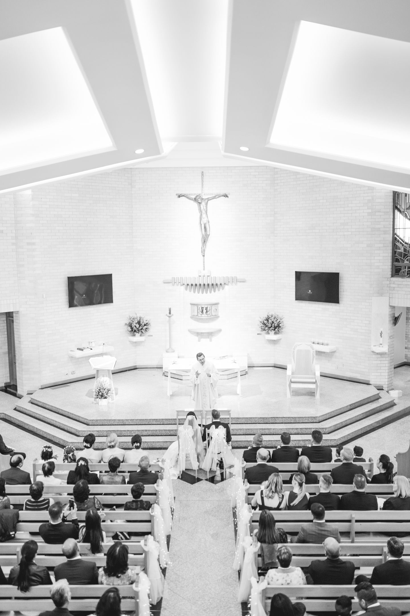 A fusion wedding ceremony taking place inside St Bernadettes Church Castle Hill.