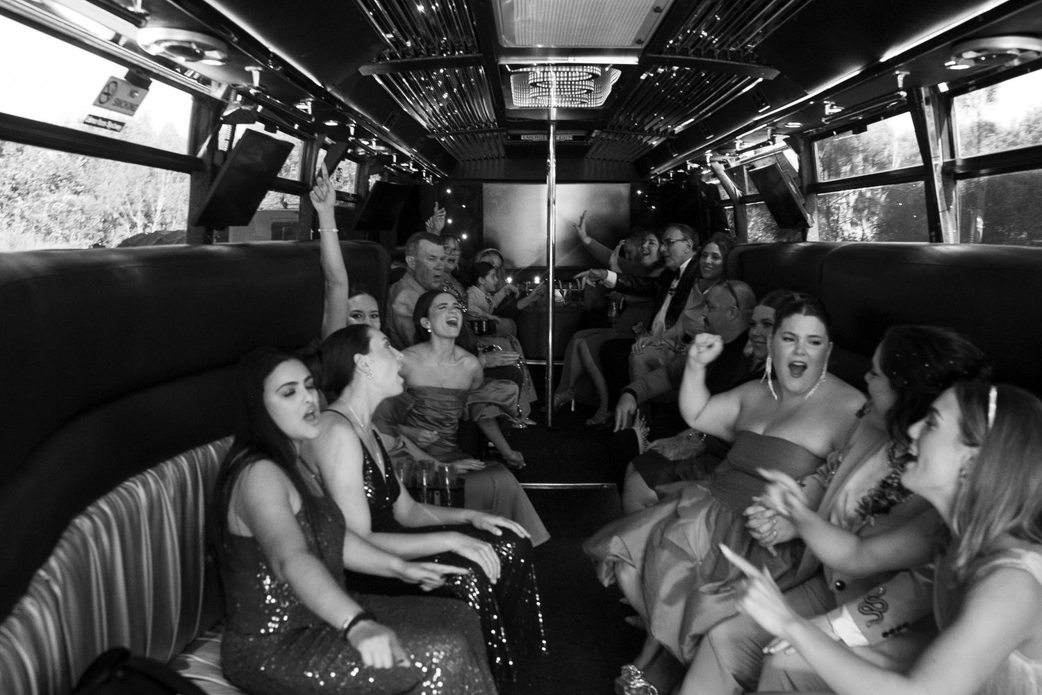 Joyful candid moment of the couple arriving on their wedding party bus in Sydney.