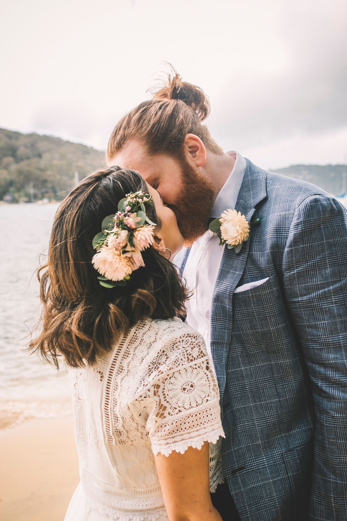 Golden hour portrait of the couple by the water at Church Point by Koco Weddings.