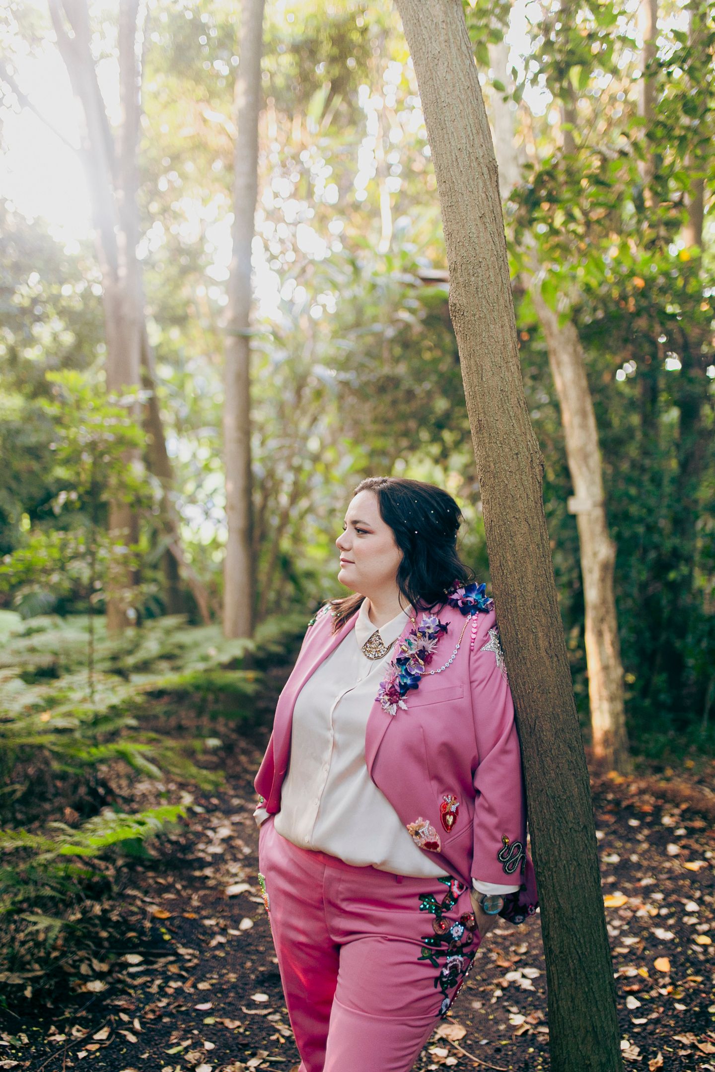 Artistic portrait of the brides embracing in the Royal Botanic Garden Sydney by Koco Weddings.