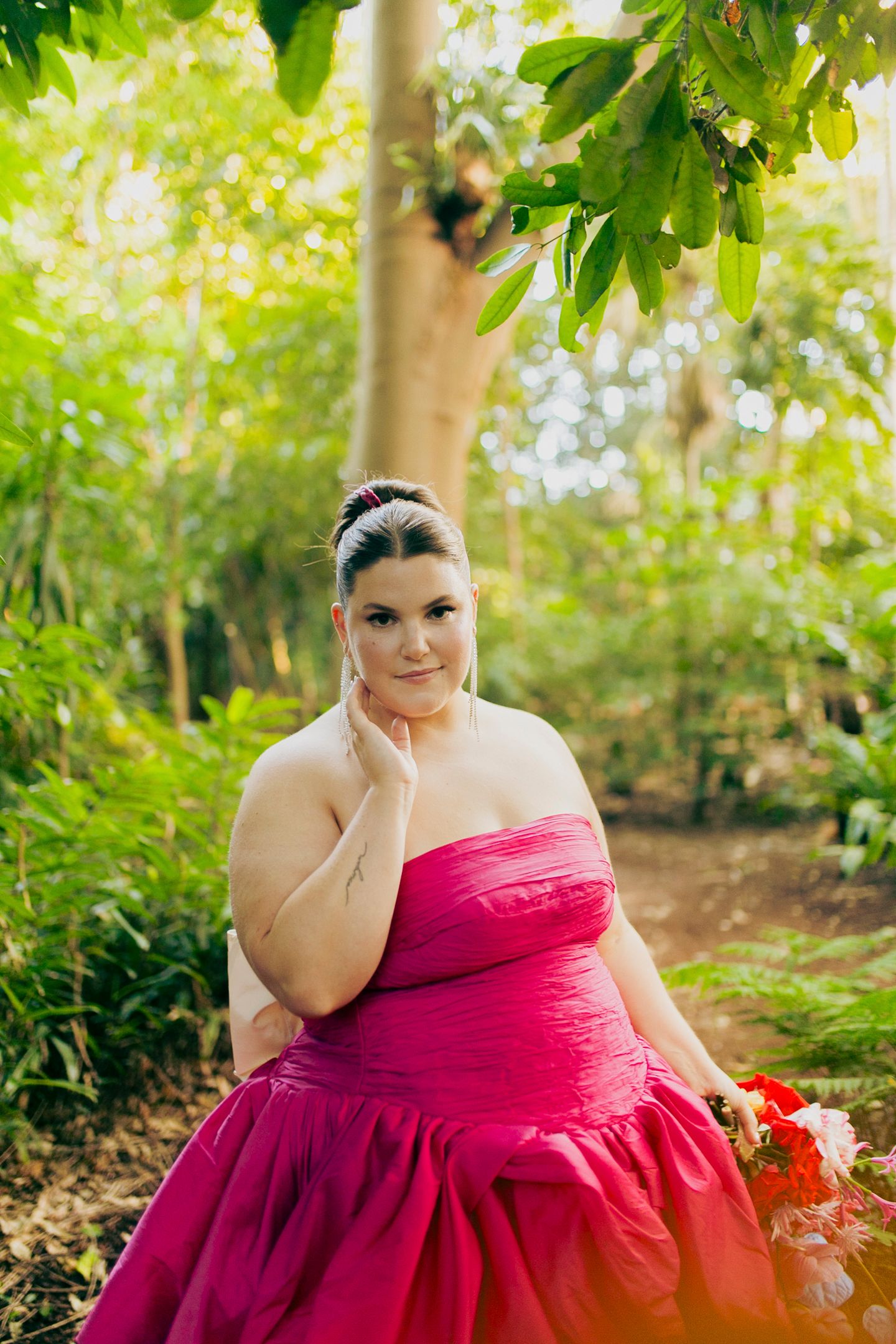 Artistic portrait of the brides embracing in the Royal Botanic Garden Sydney by Koco Weddings.