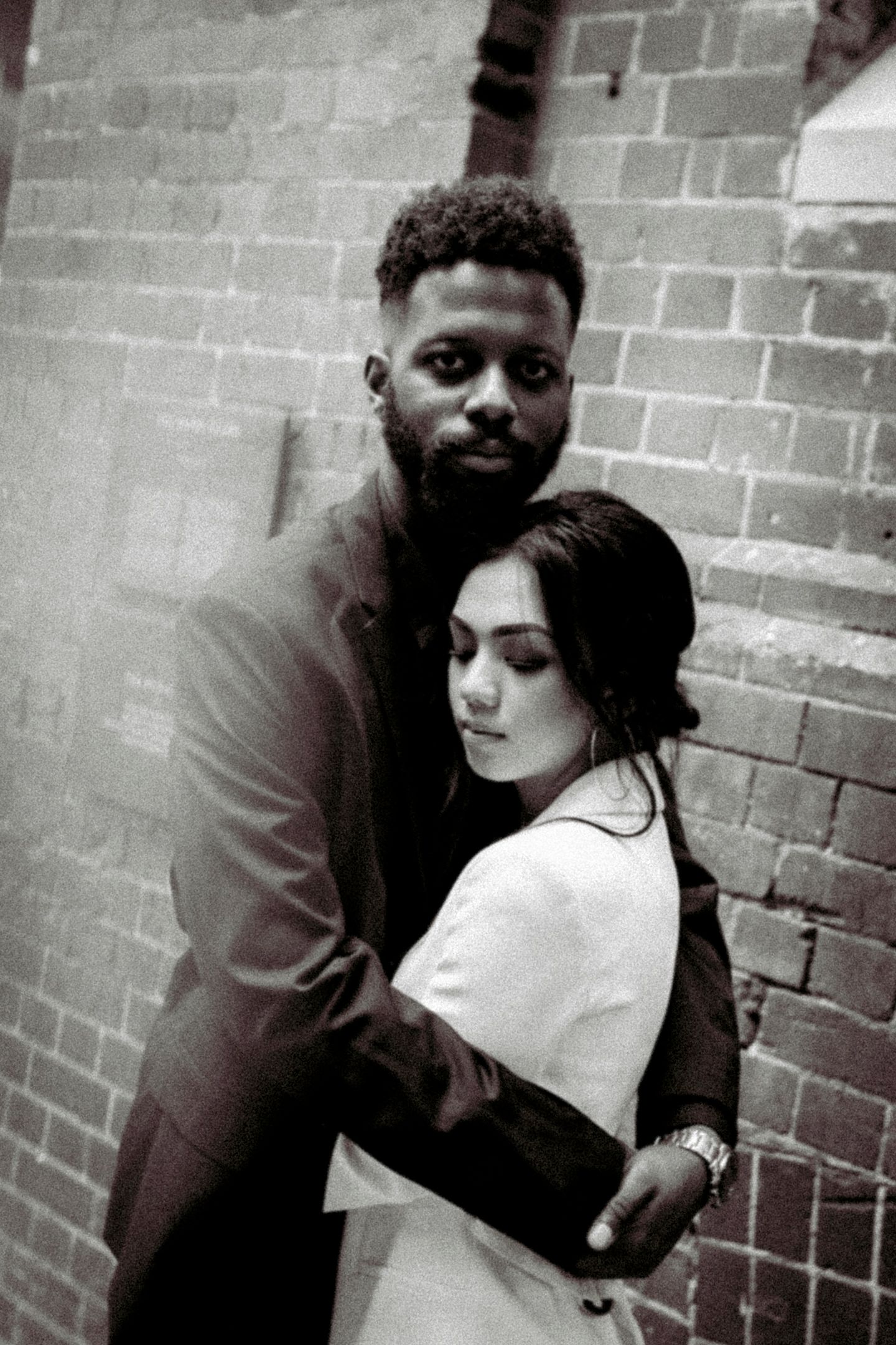 Modern black and white editorial portrait of Mo and Chakriya on Kensington Street.