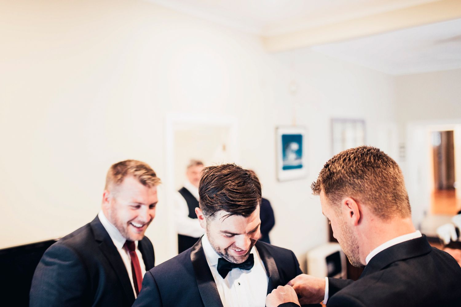 Classic black and white photo of the groom’s Peter Jackson tuxedo details.