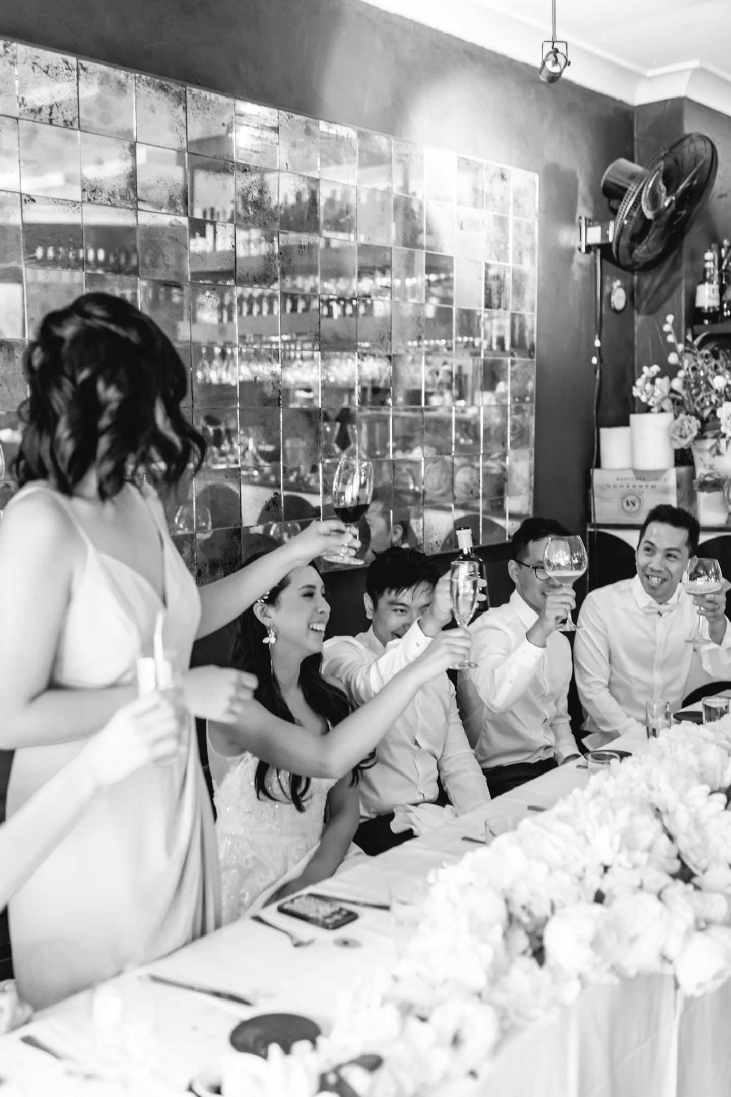 Candid joy shared between the couple during their relaxed restaurant reception speeches.