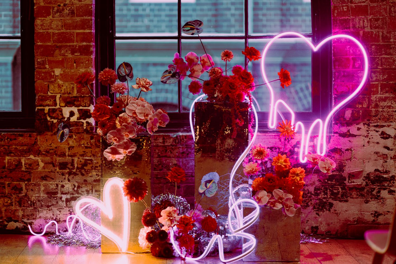 The bright, industrial-chic interior of Olio Kensington Street set for a colourful reception.
