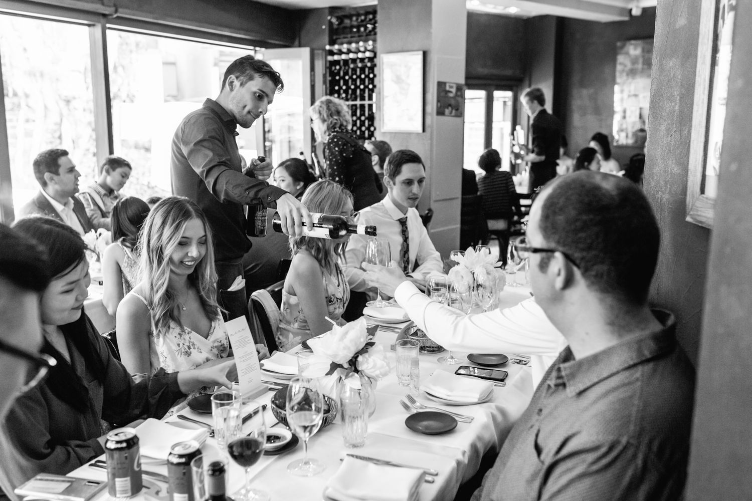 Long table Italian-style lunch reception setup inside Bei Amici restaurant.