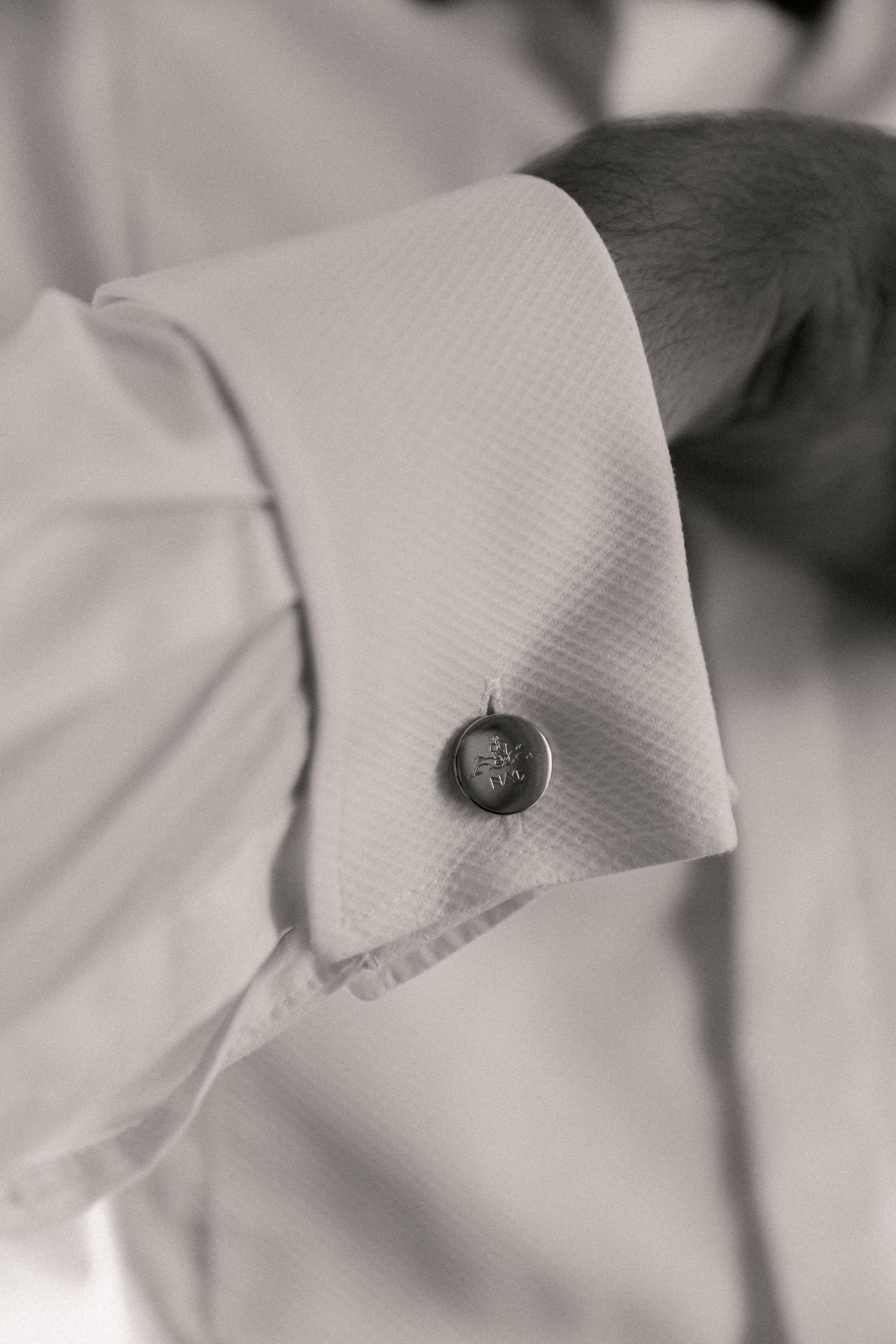 Black and white image of grooms personalised cufflinks for wedding day
