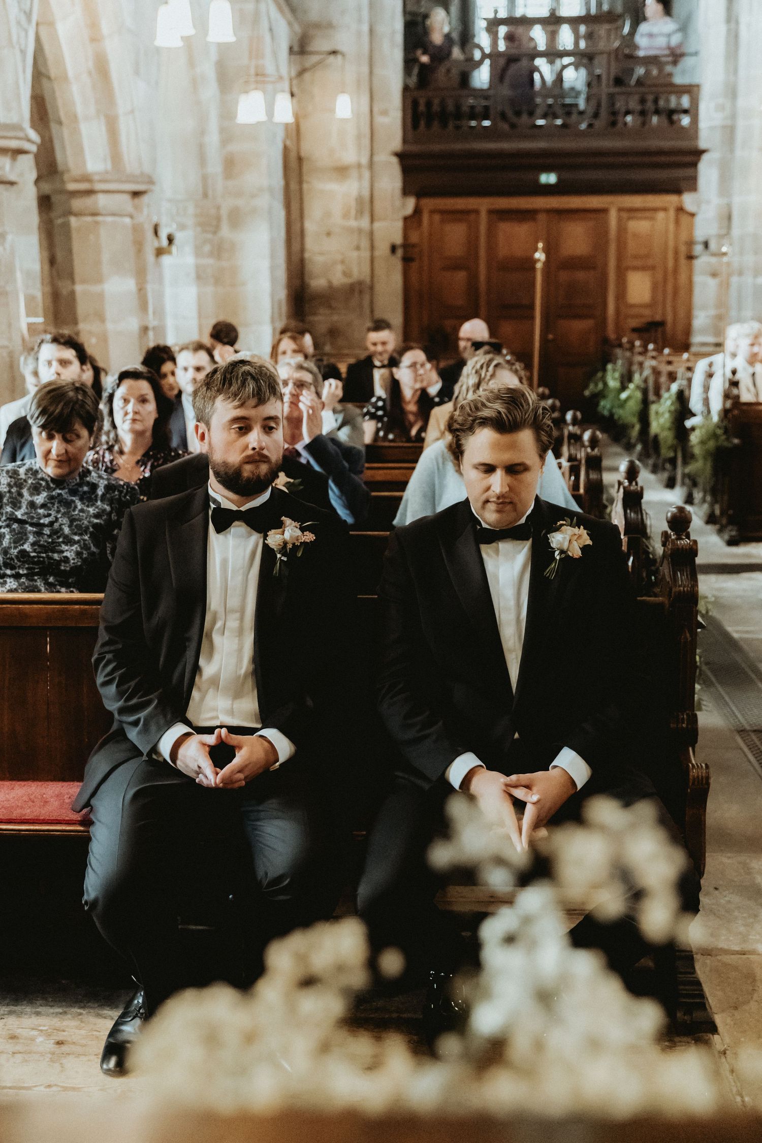 Close up of groom and best man waiting for bride to arrive