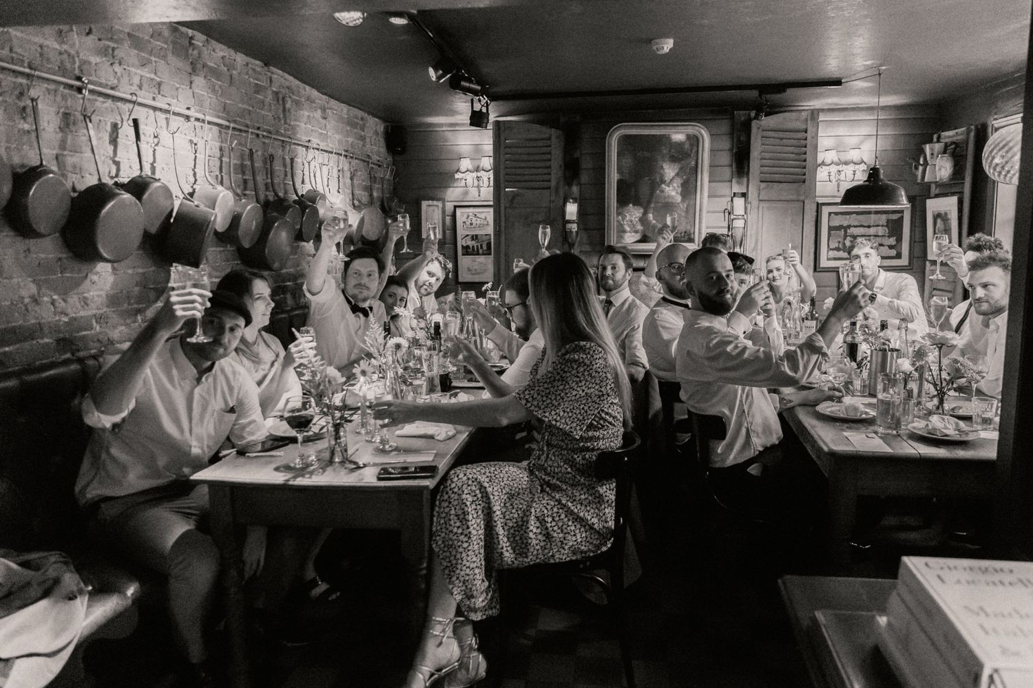 Wedding party raising a toast to the newlyweds at The Roebuck Inn