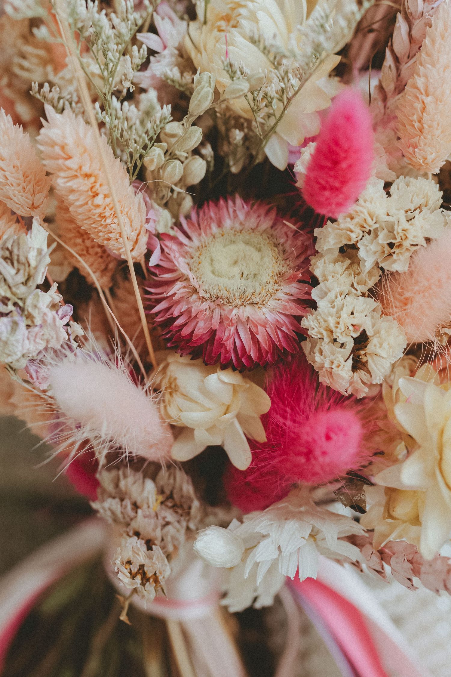 Pink and orange dried flower wedding day bouquet from Happy Blossom.
