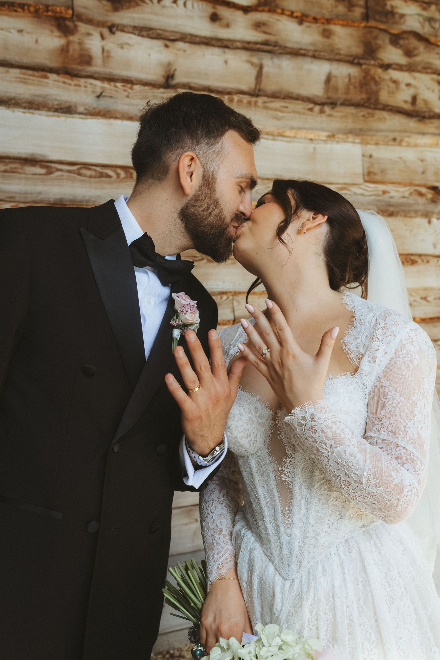 Bride and groom sharing kiss on wedding day at Tower Hill Barns in North Wales wedding Photography