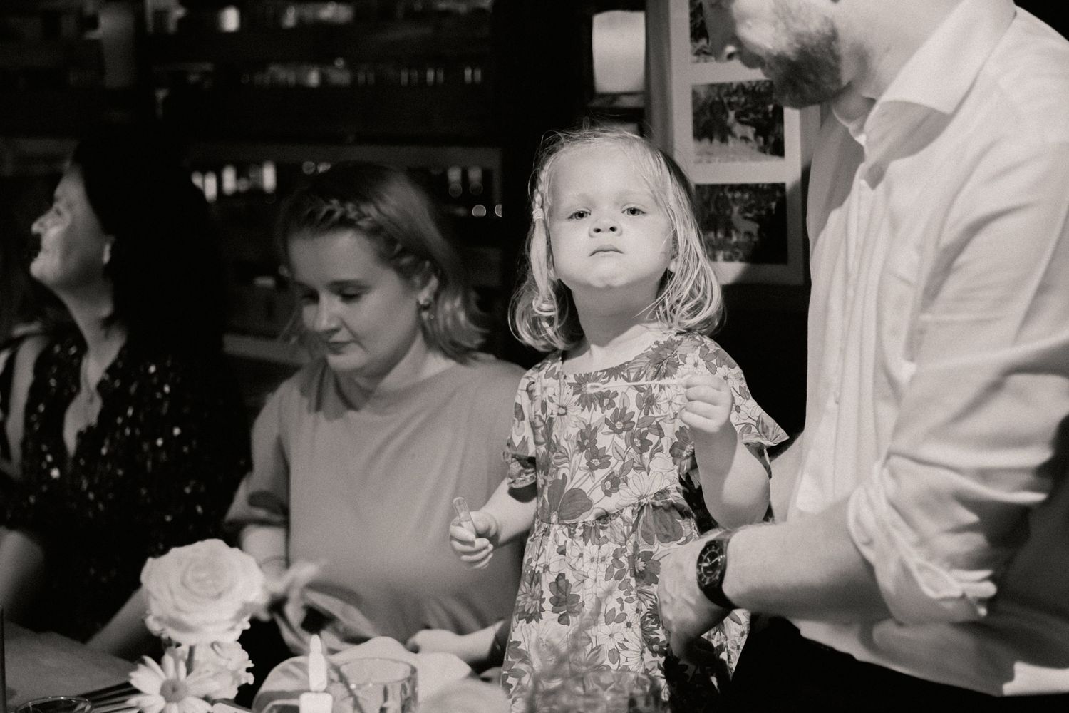 Little girl standing on chair during speeches at wedding in The Roebuck Inn