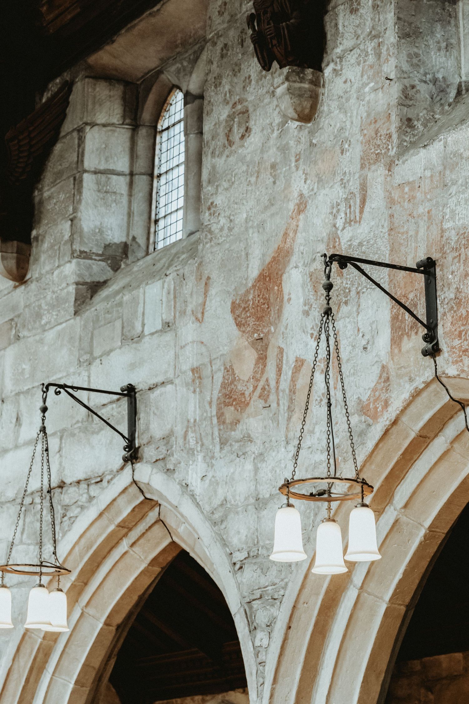 Details of St Wilfrids church walls with hanging wall lights