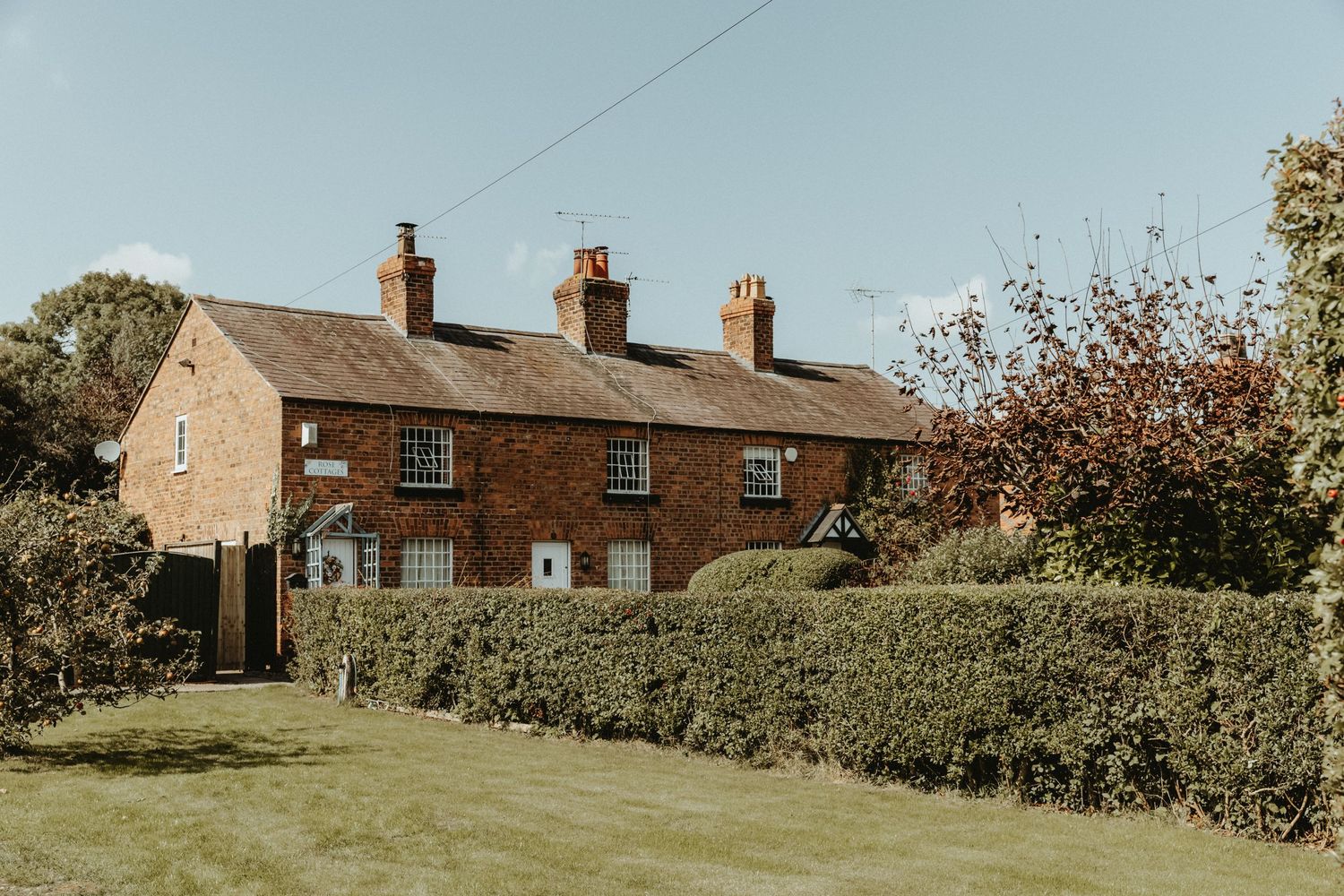 A row of terraced houses in Doddleston on a sunny day