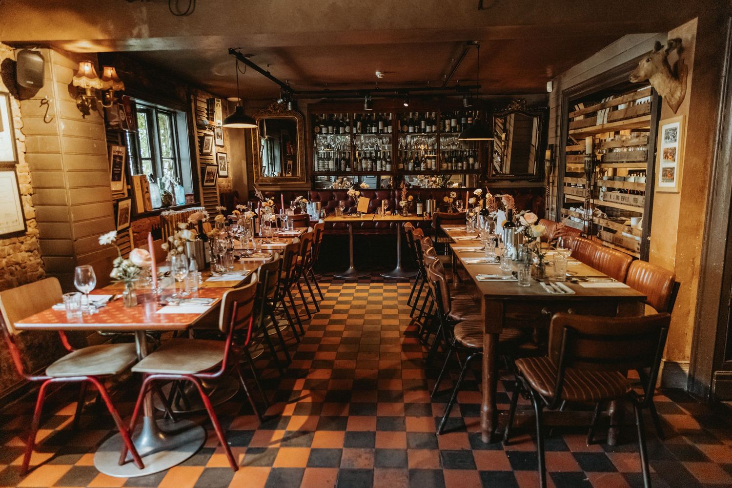 Interior of The Roebuck Inn set for dining with flowers on the table