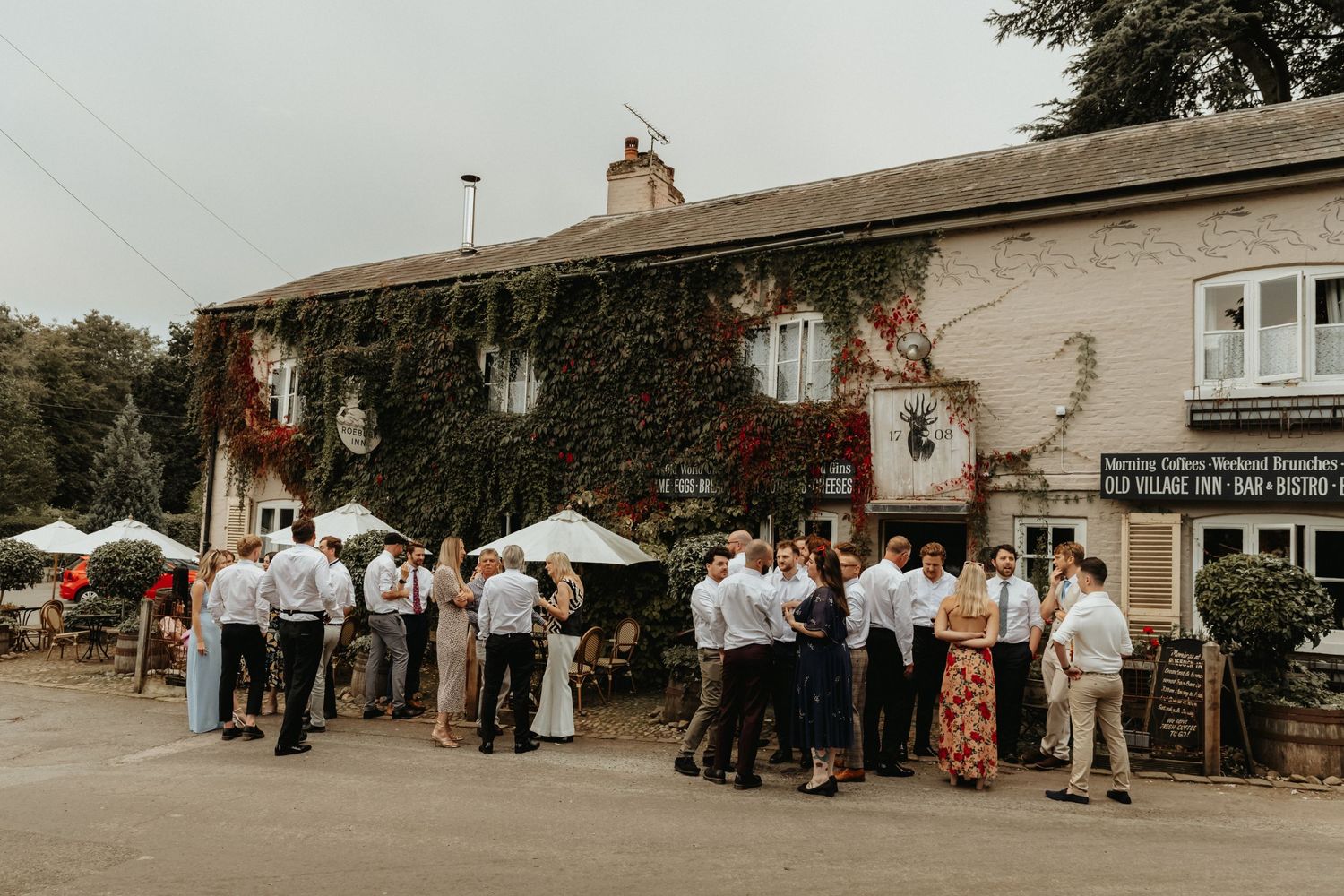 Wedding party outside The Roebuck Inn