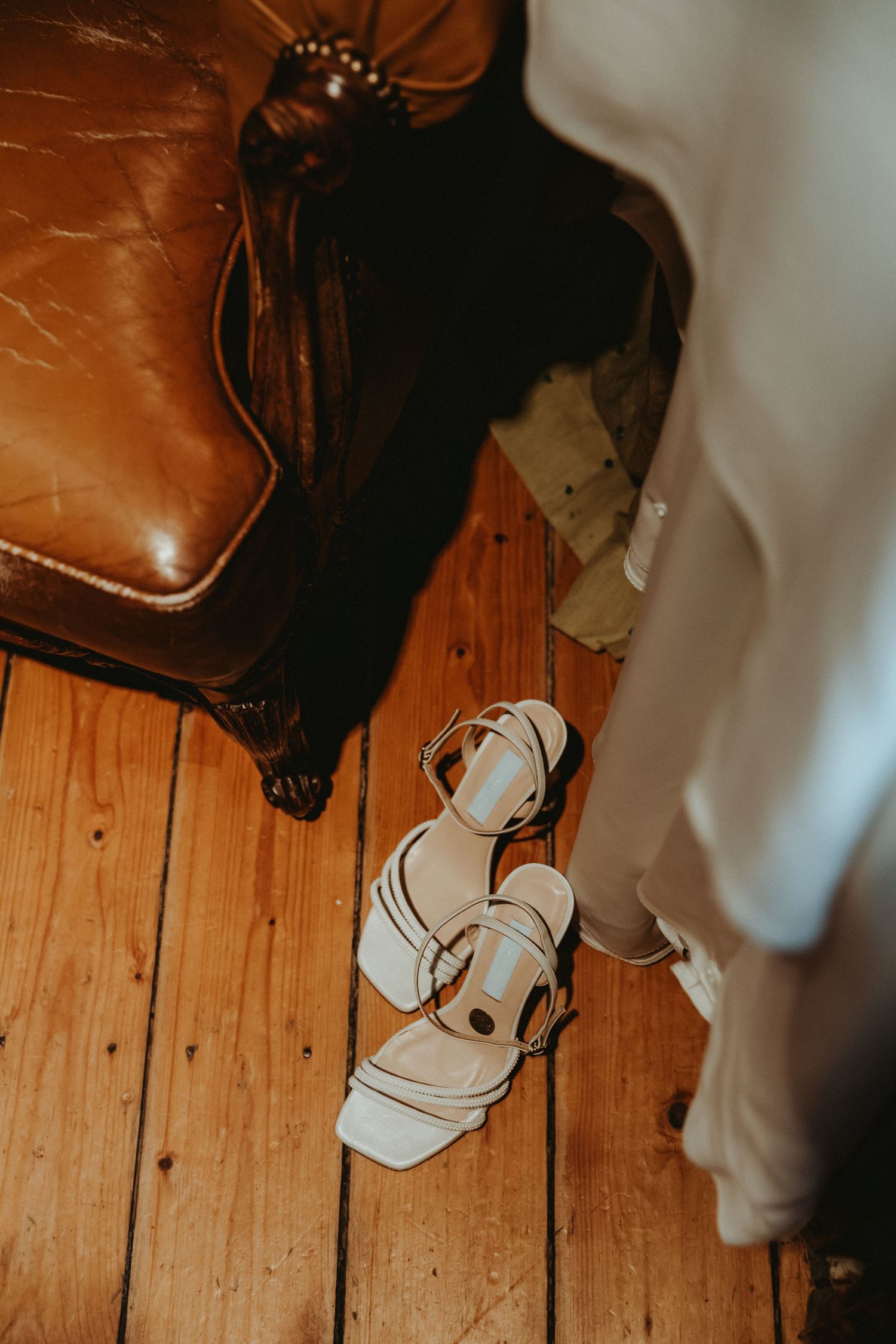 Brides Charlotte Mills shoes next to wedding dress