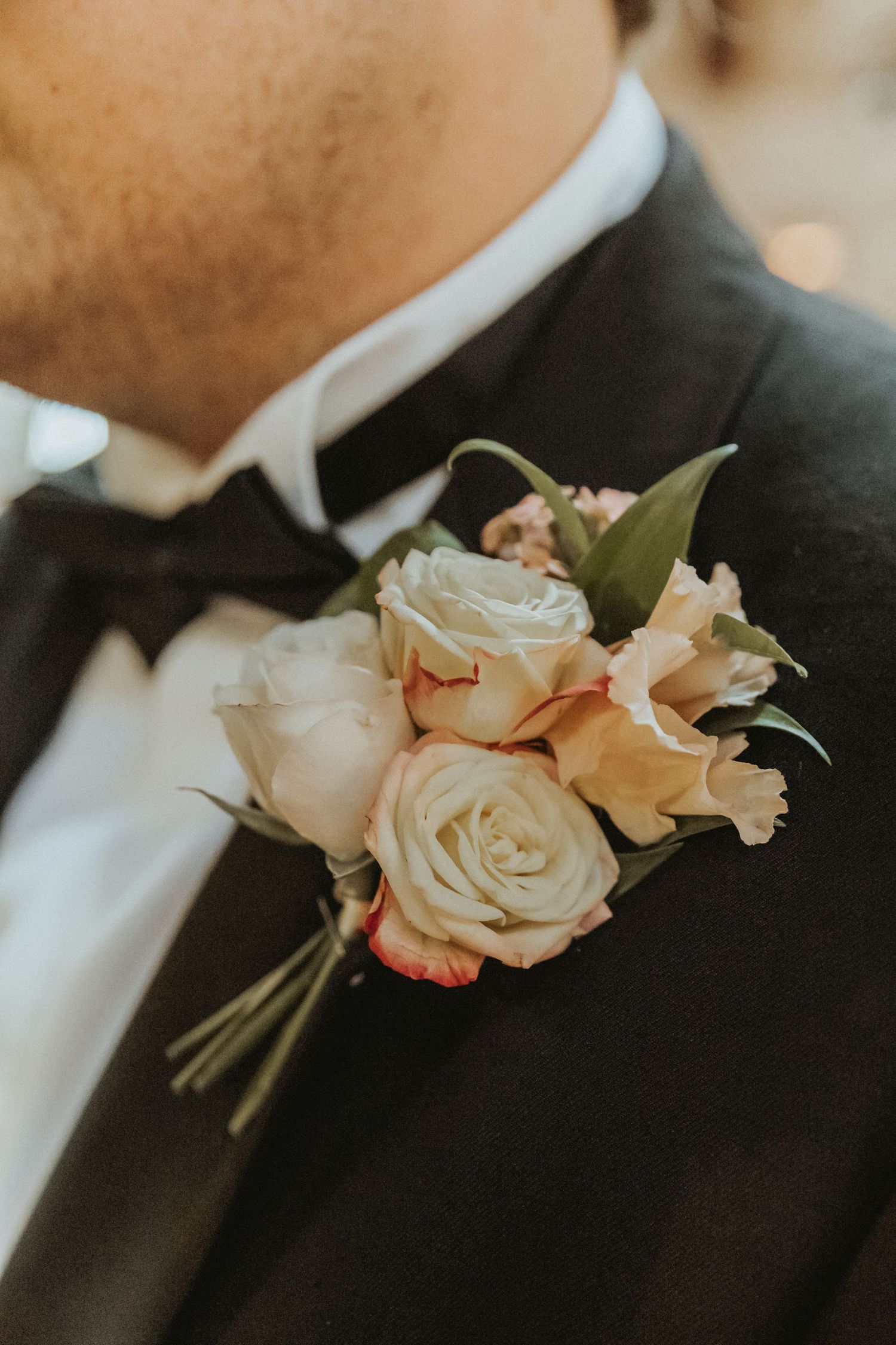 Grooms boutonnière flowers close up at church