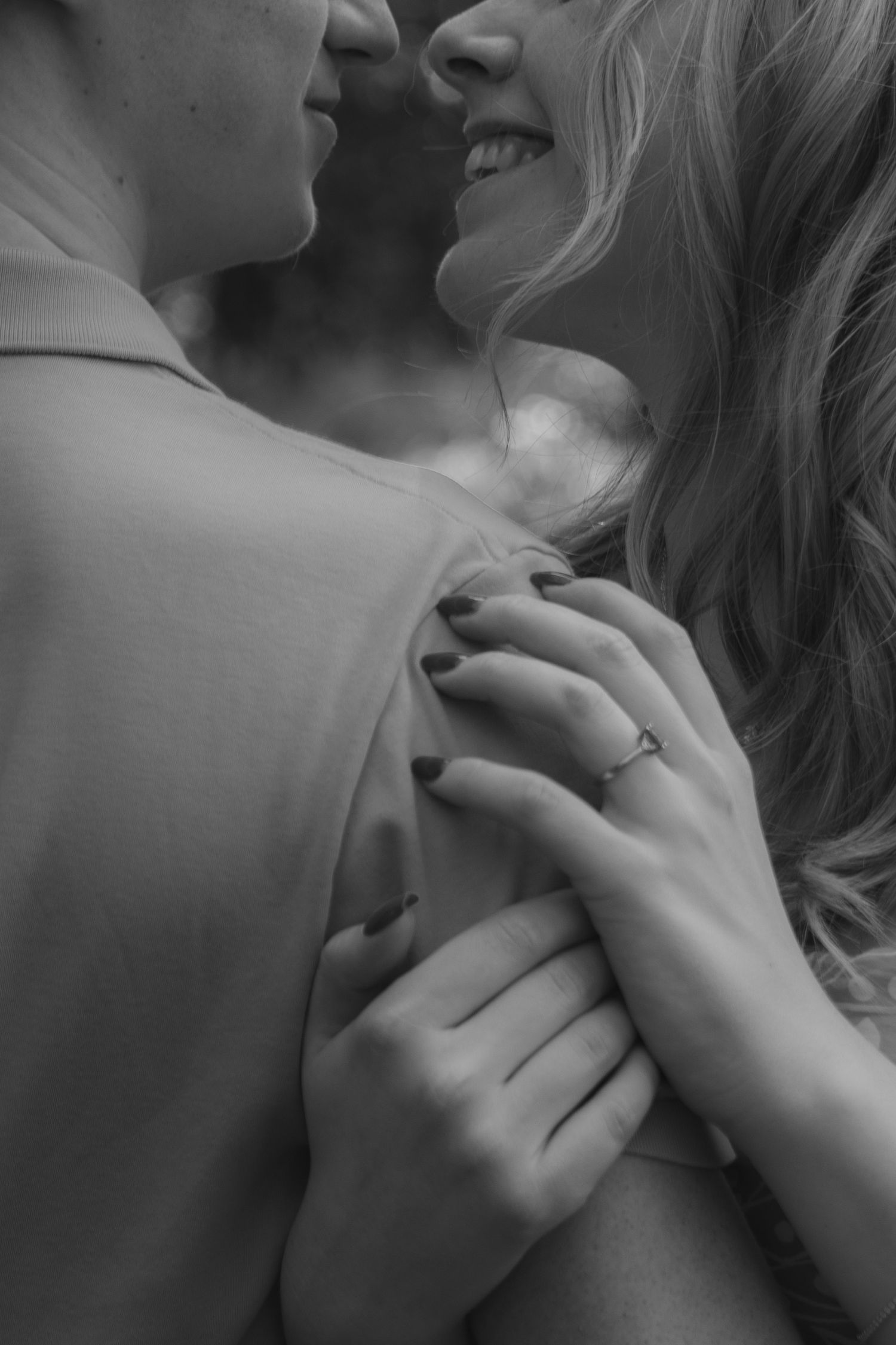 Boy and girl hugging very closely and embracing the simplicity of touch with someone you love.