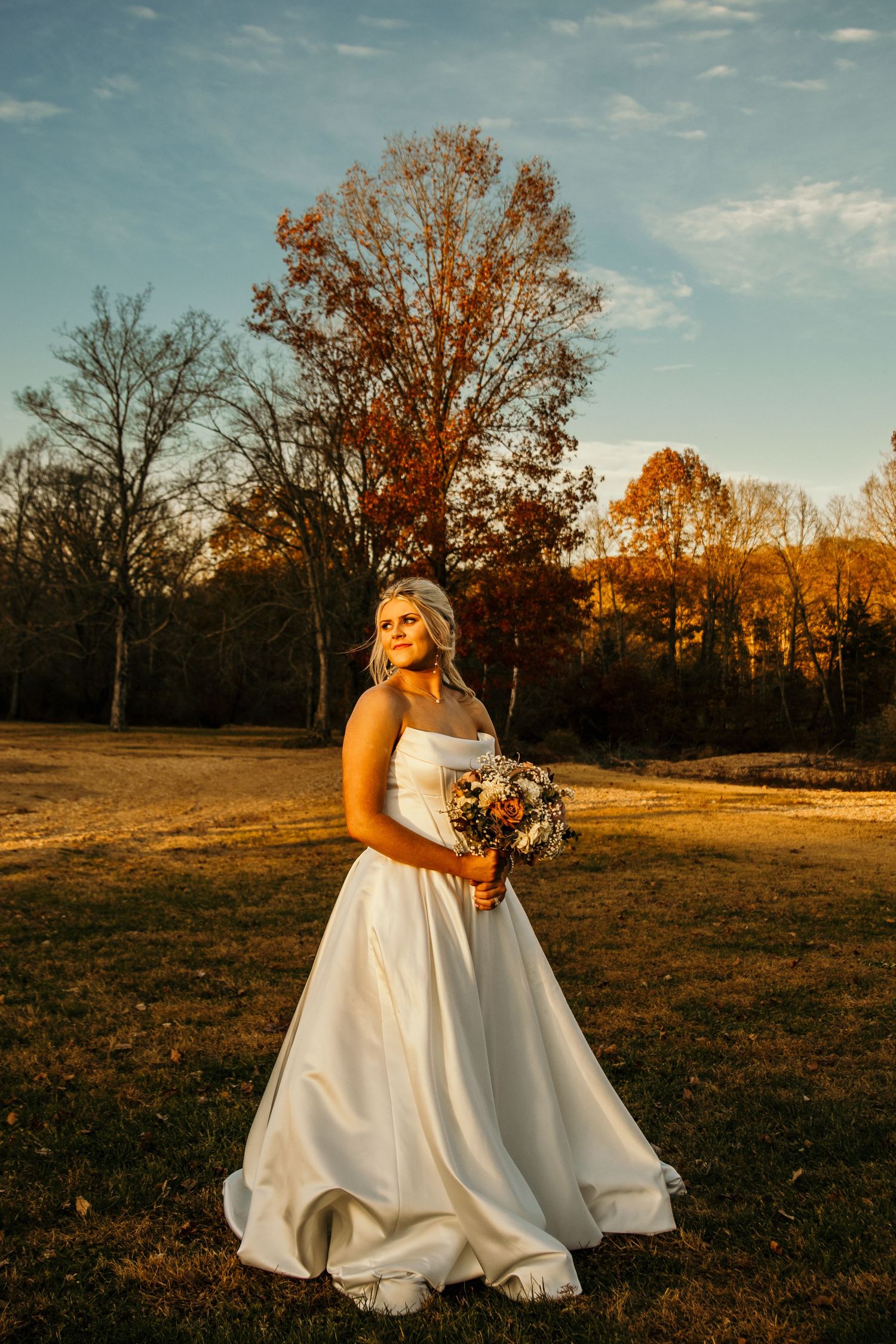 bridal portrait looking into the distance and golden hour